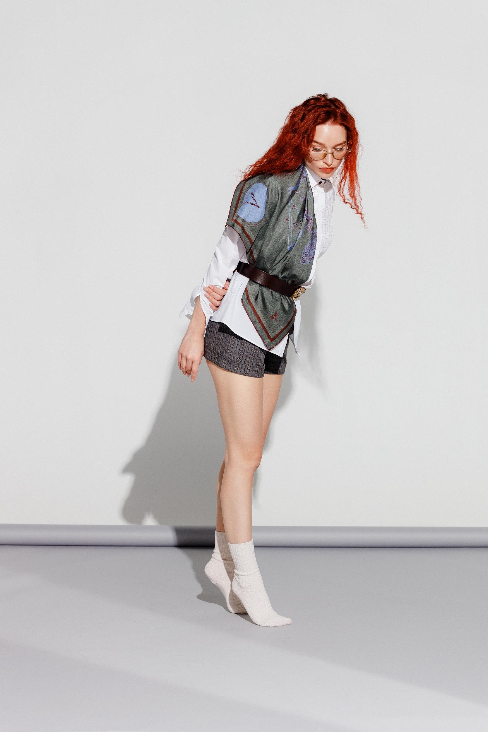 Model wearing silk twill square scarf over shoulder