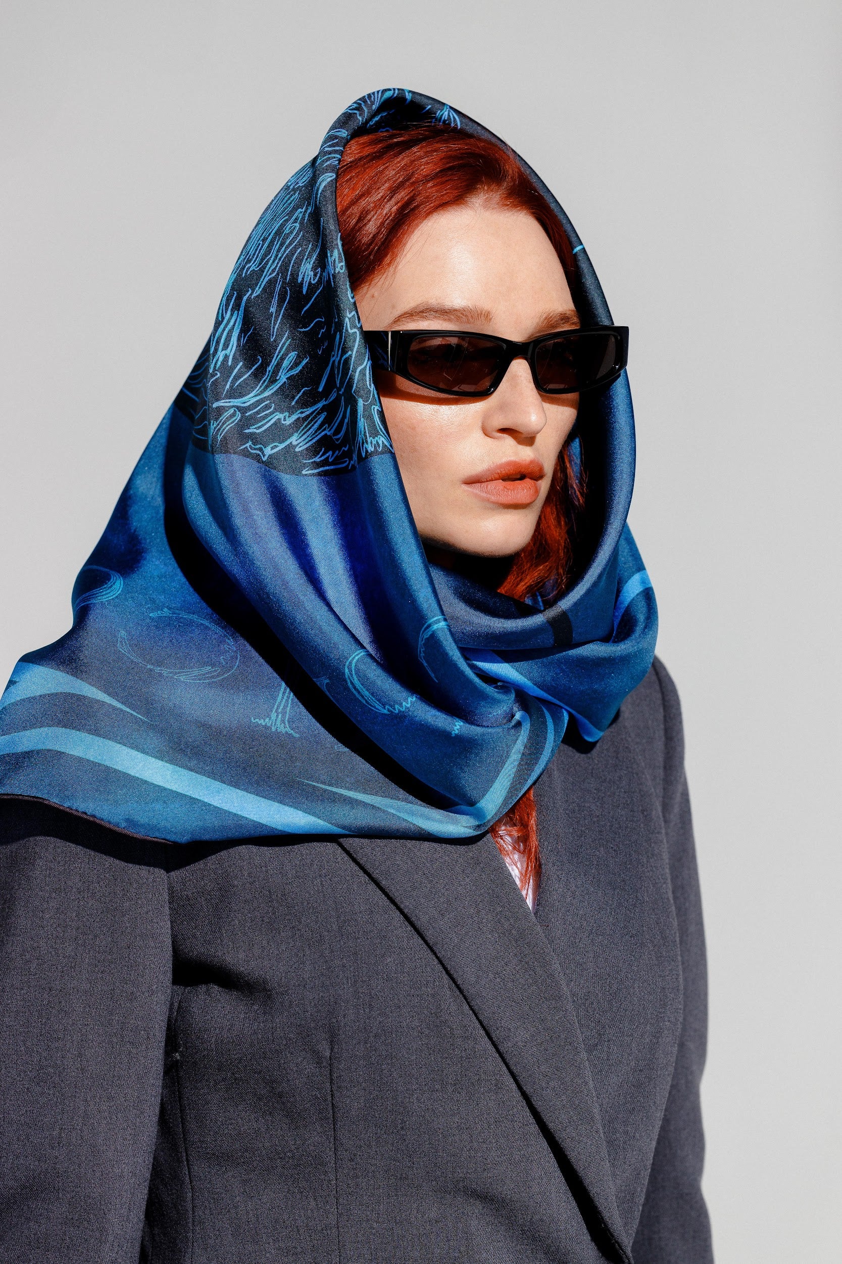 Model wearing blue silk twill square scarf as head wrap