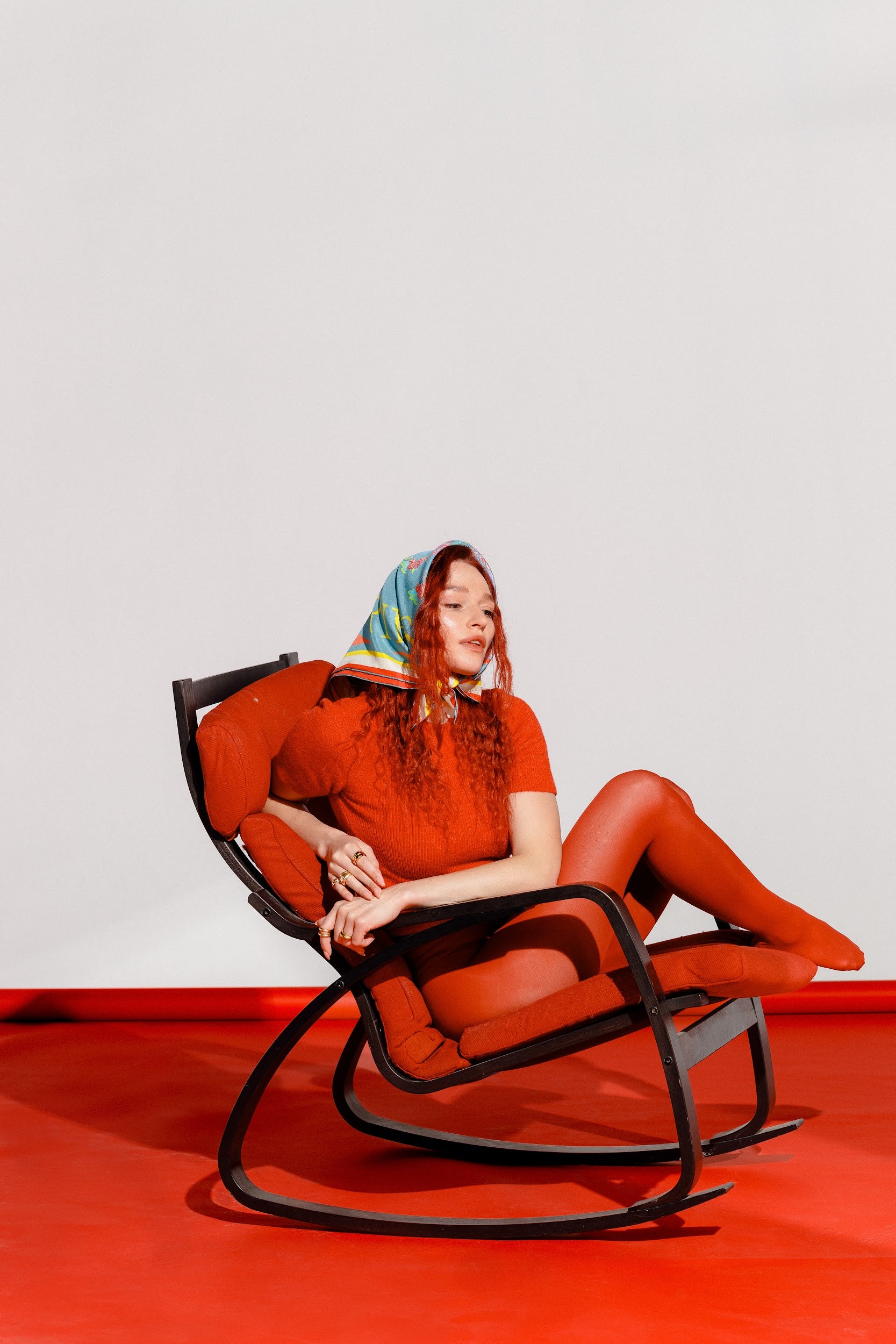 Model wearing silk twill square scarf as bandana on head