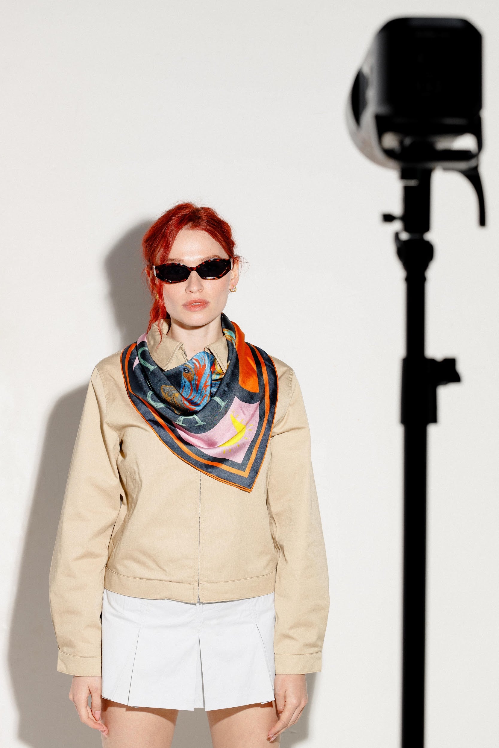 Model wearing silk twill square scarf around neck