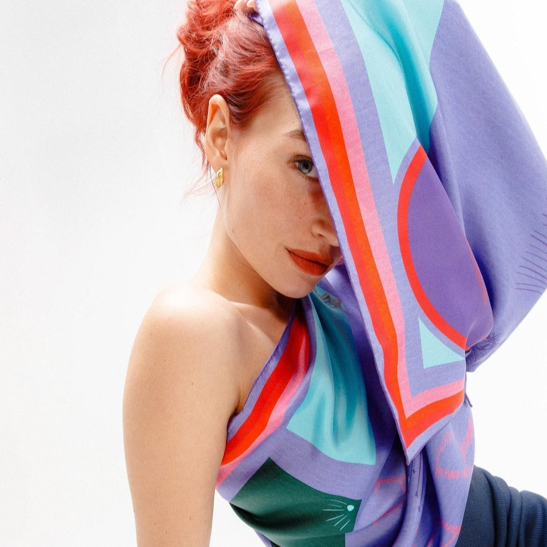 Model wearing silk twill square scarf as one arm top