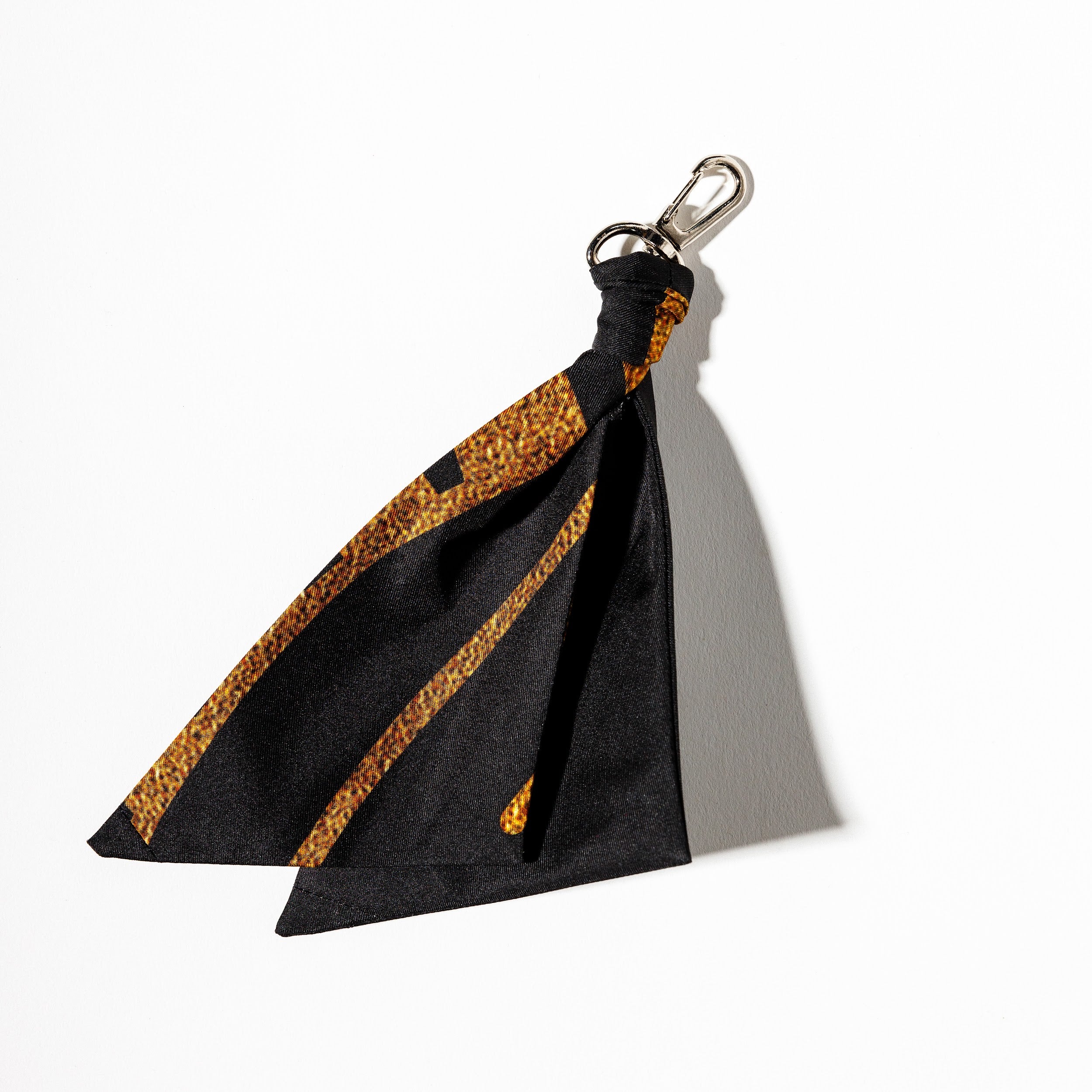 100% silk black and gold bag charm on silver hook
