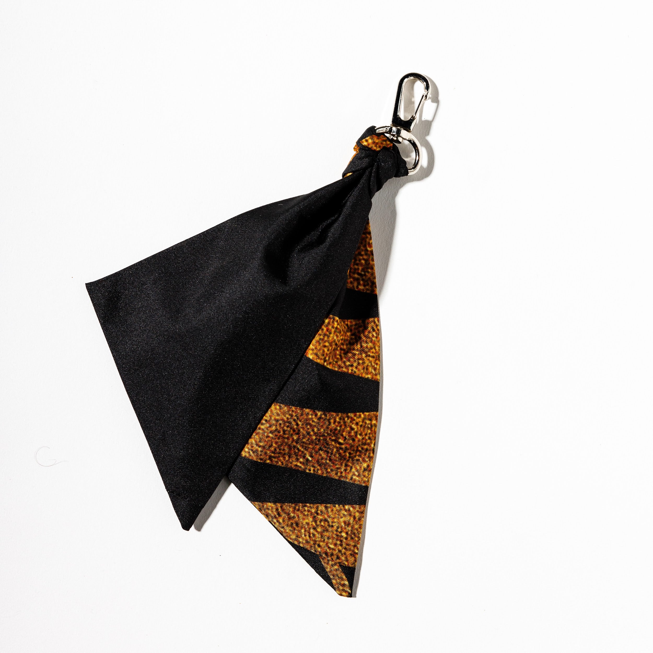 100% Silk black and gold bag charm on silver hook