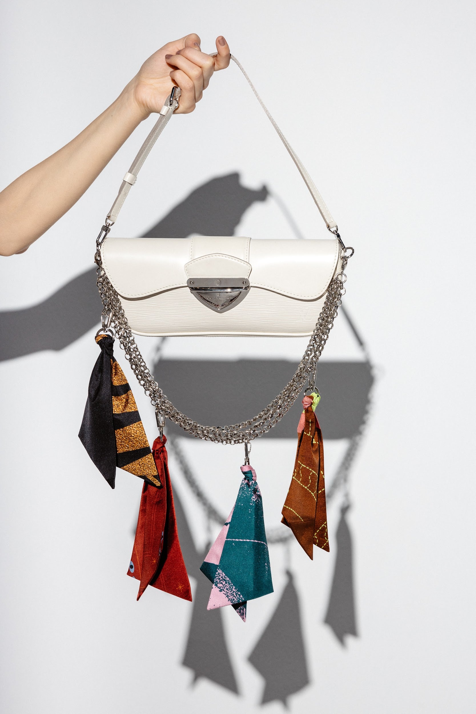 100% silk bag charms in different colors hooked on bag