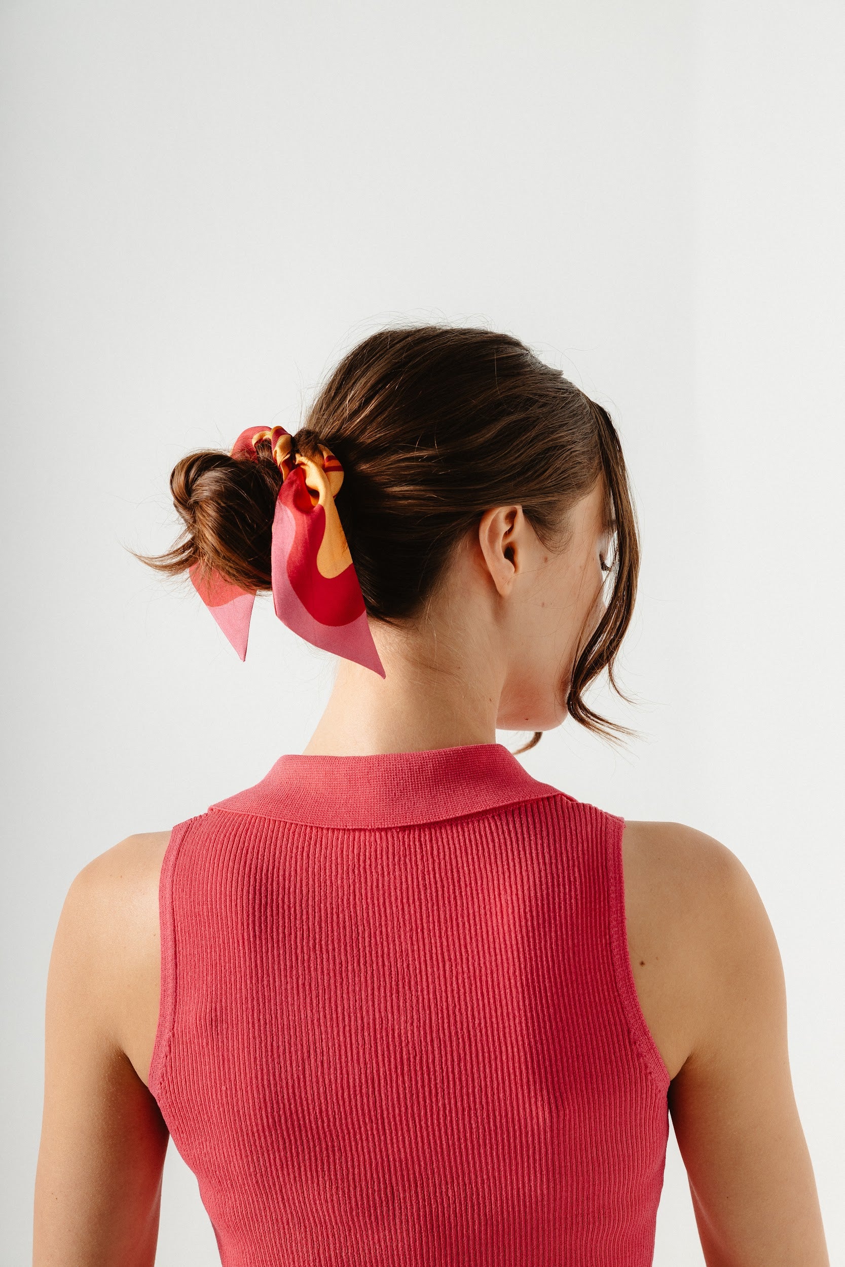 Silk twilly carf tied around bun