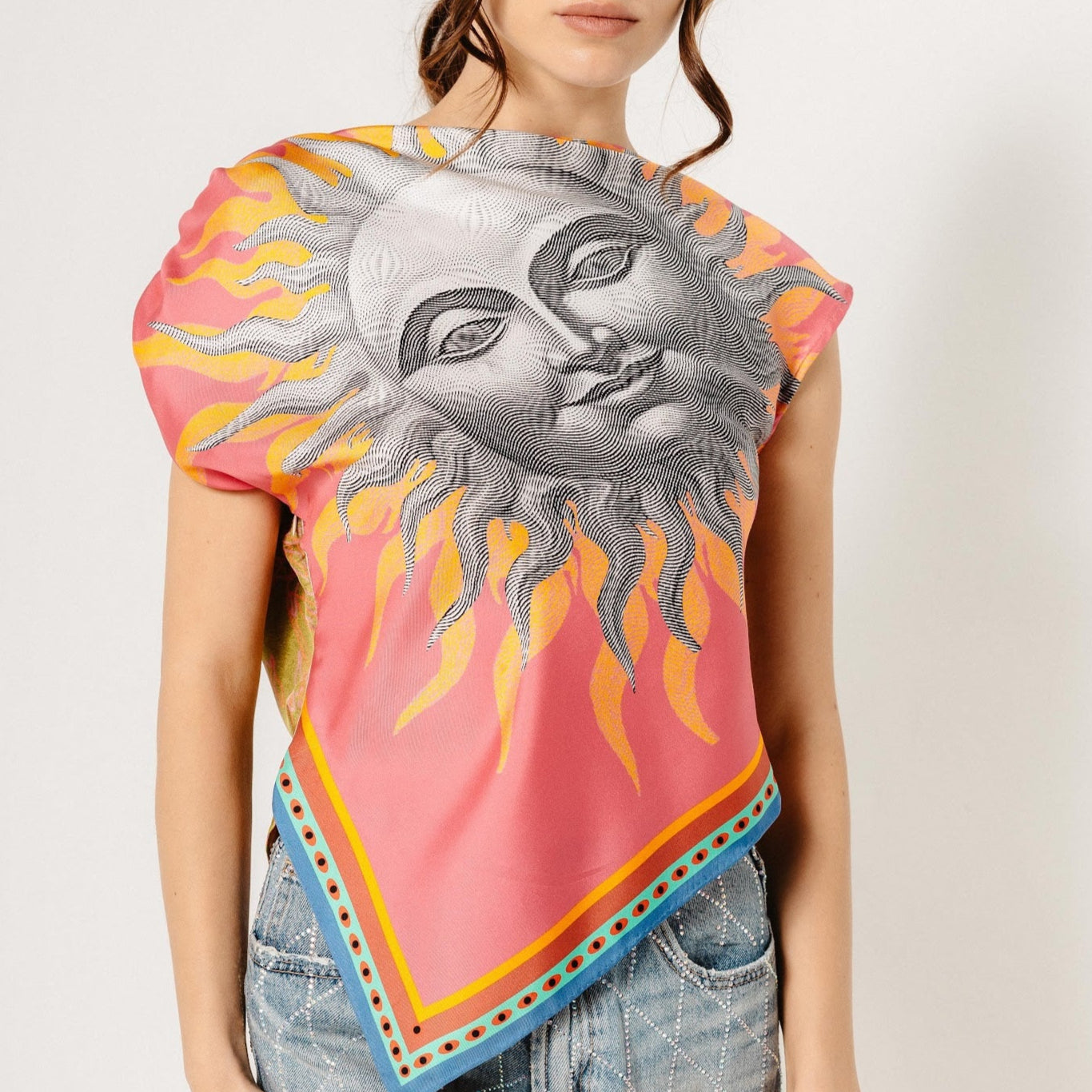 Model wearing asymmetrical shoulder top made from silk scarves