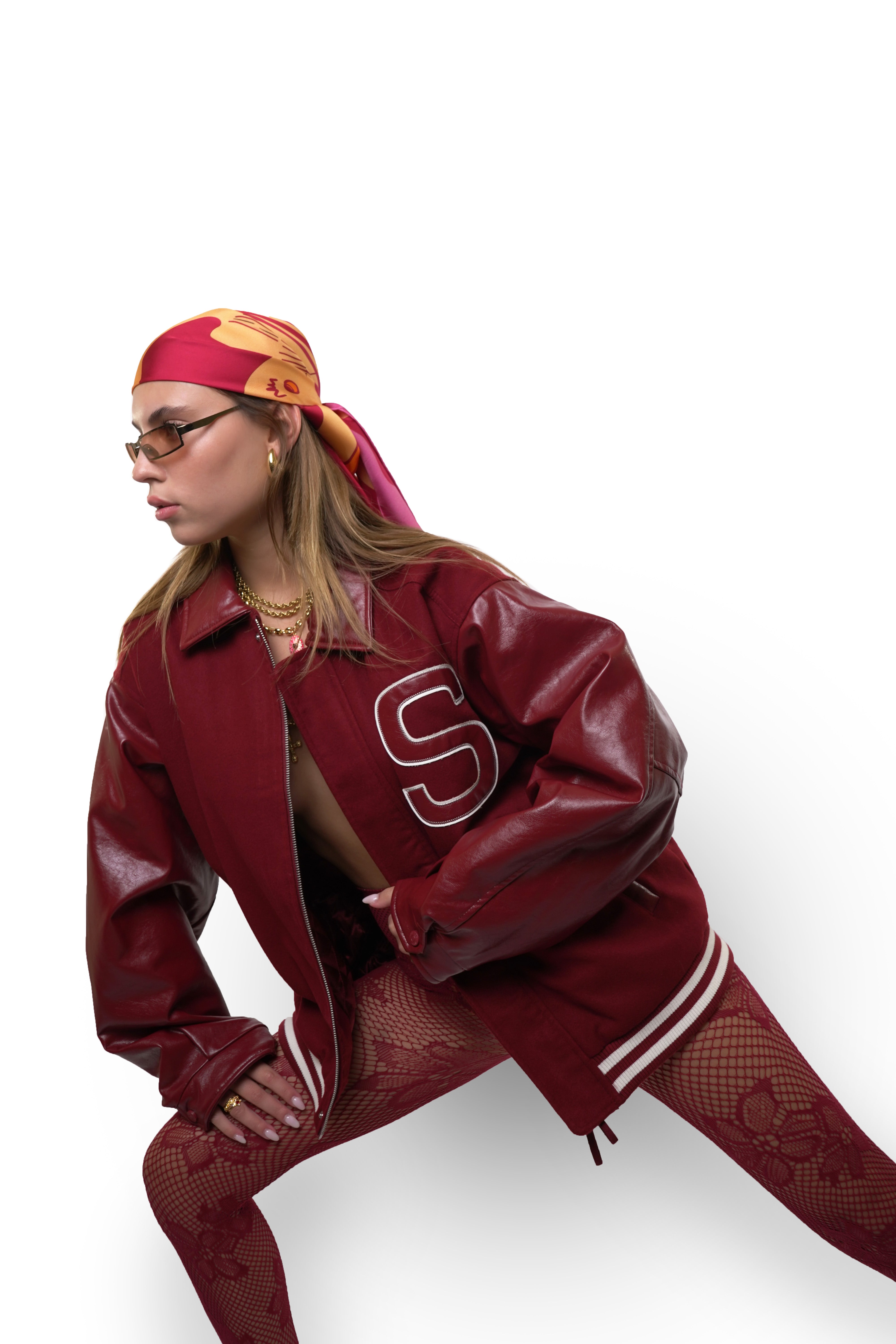 model wearing pink and orange silk twill square scarf as bandana on head