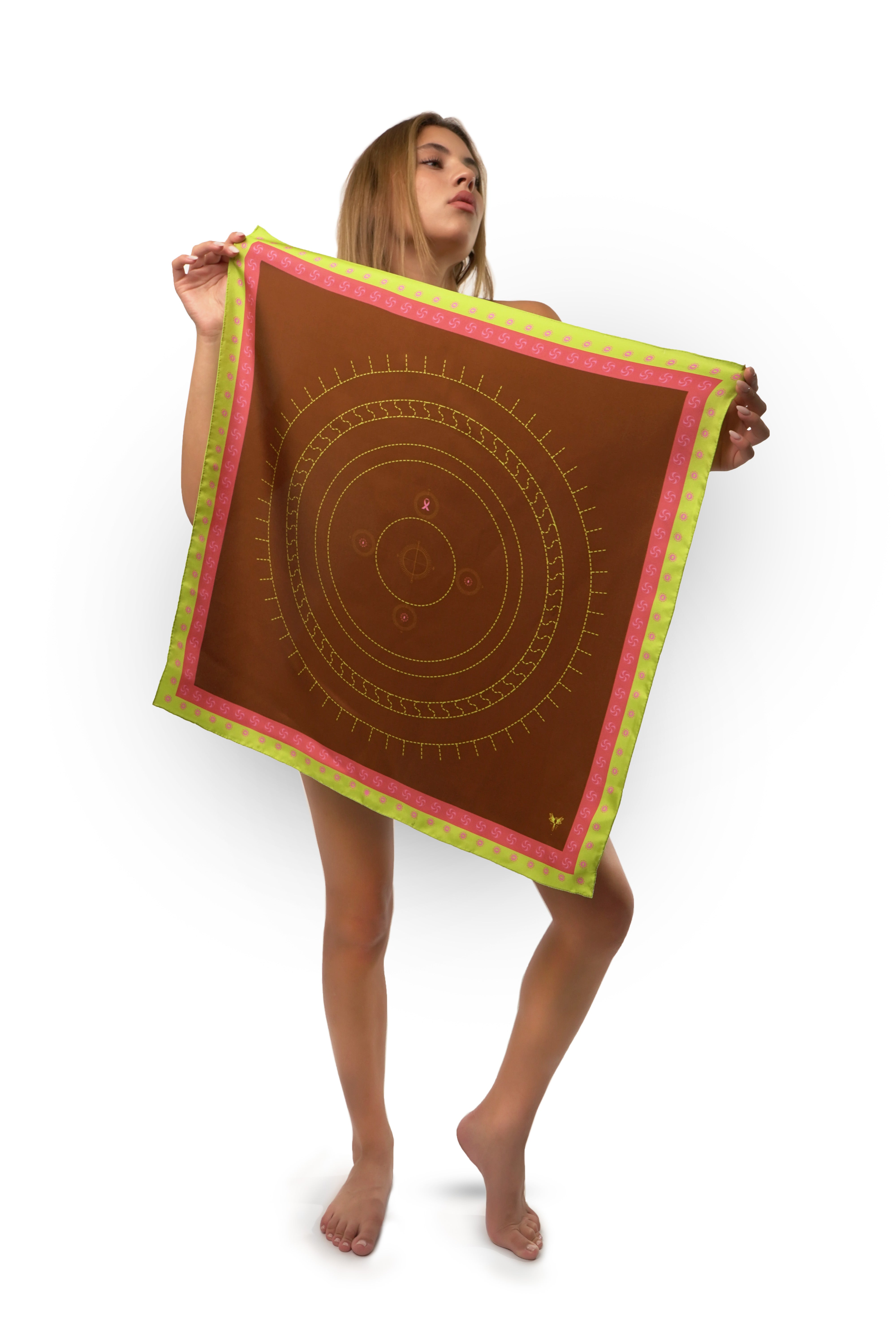 Model holding silk twill square scarf with circles design