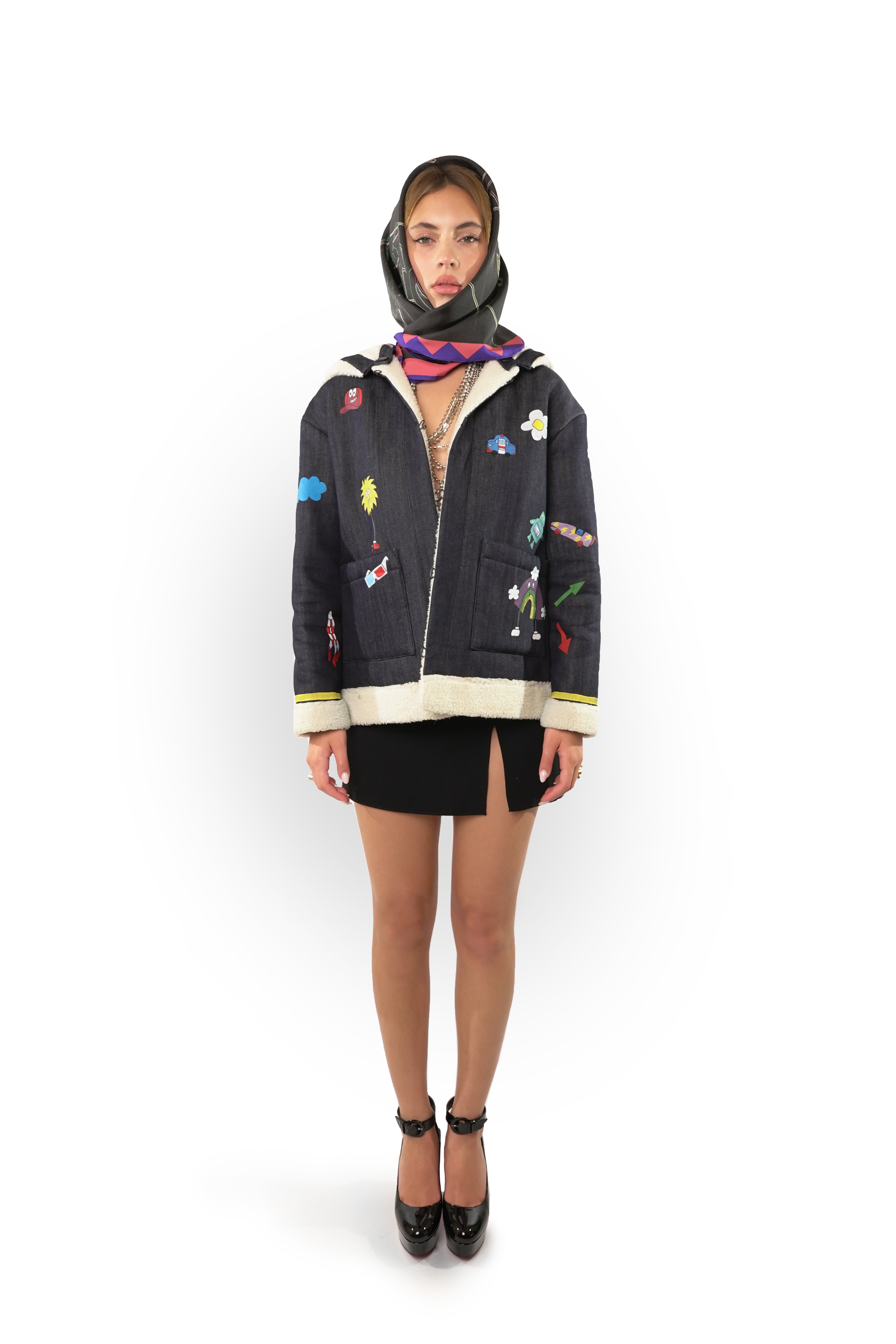 Model wearing silk twill square scarf with black pink and blue print as a head scarf