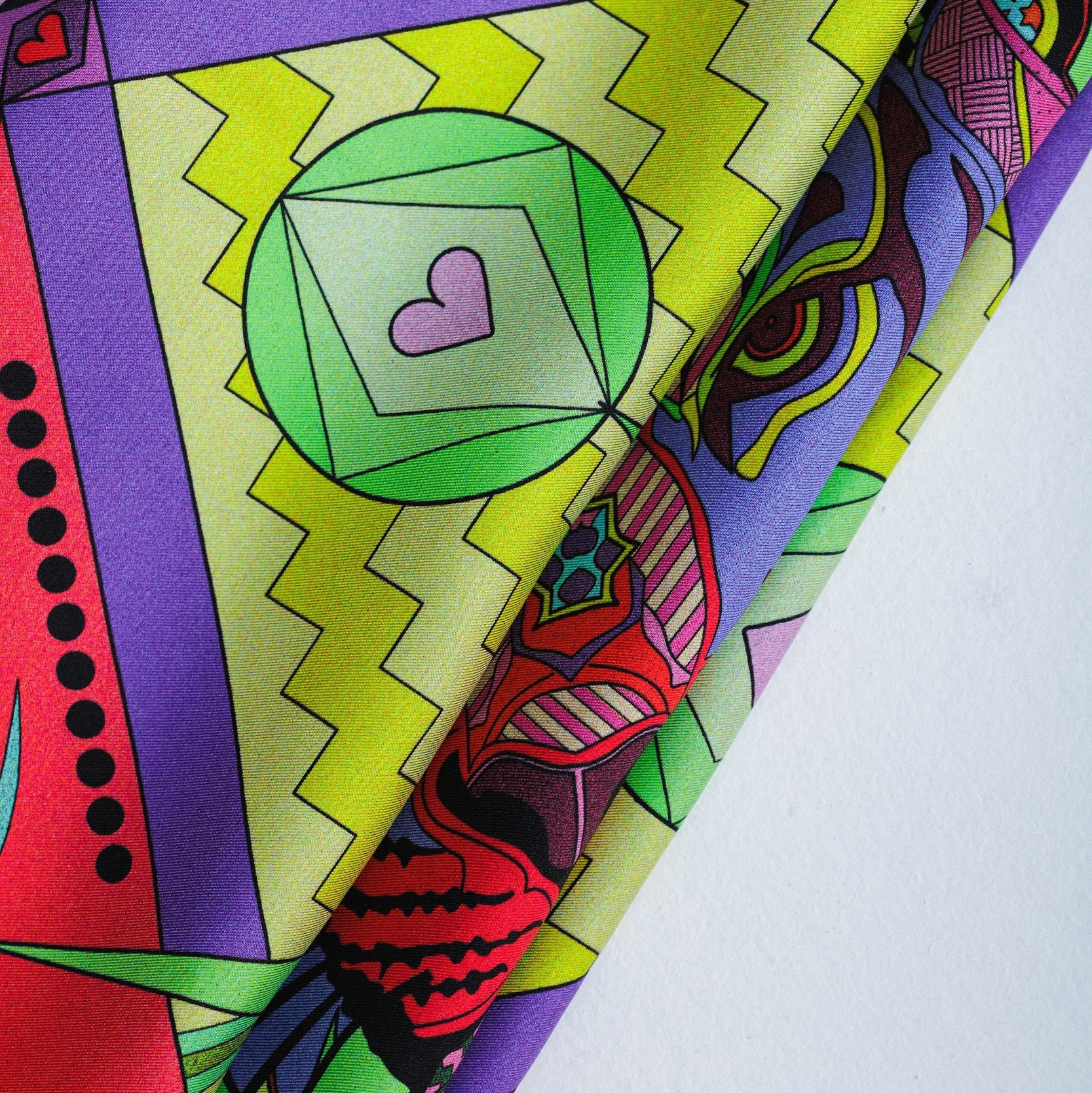 Details of colorful silk twill scarf with abstract patterns and tiger design