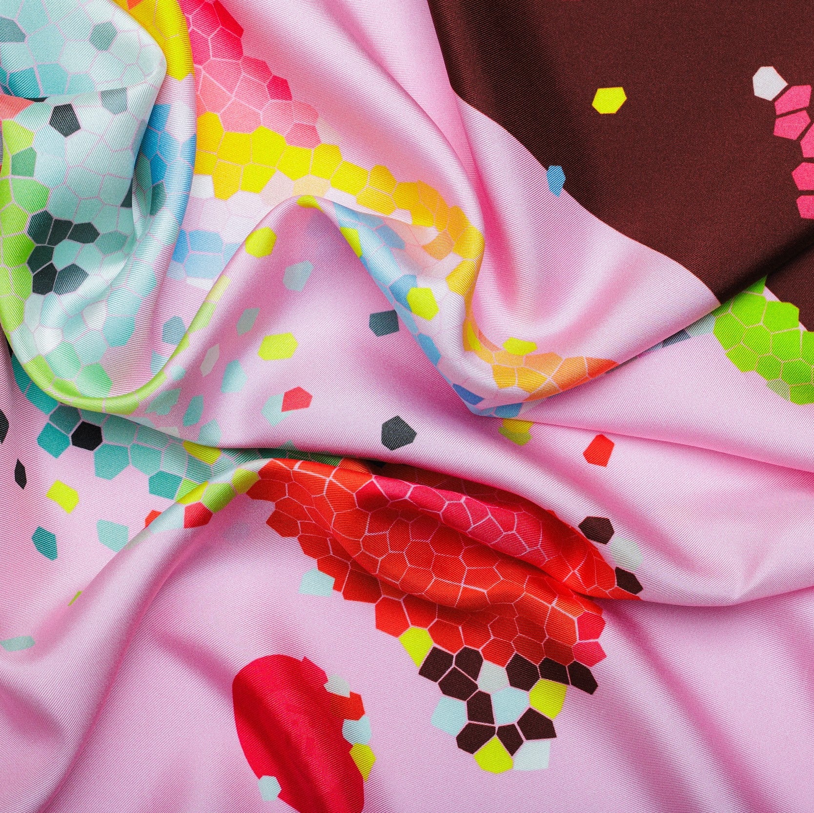 Colorful silk twill fabric close-up with abstract patterns