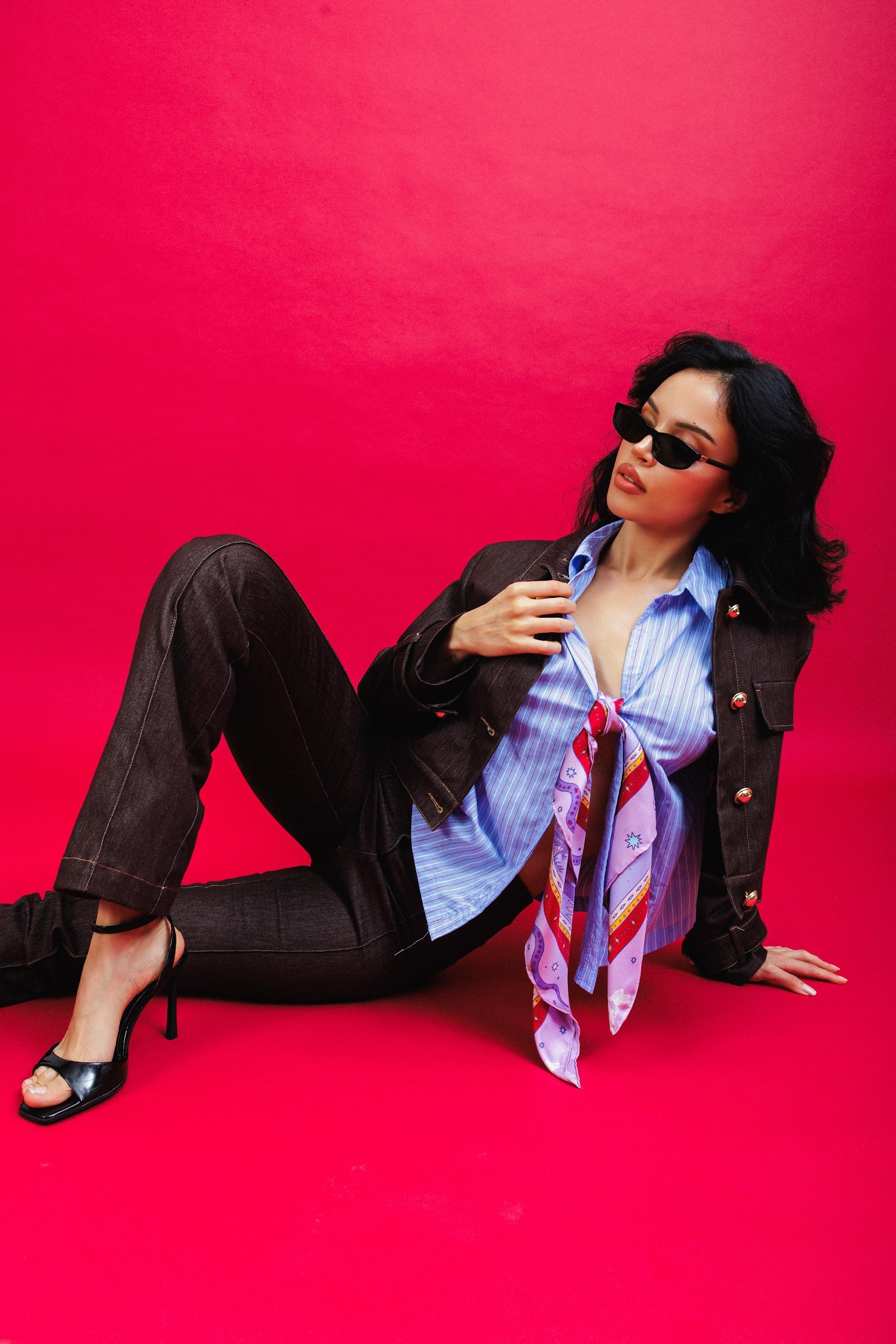 Model wearing purple silk scarf styled on her shirt