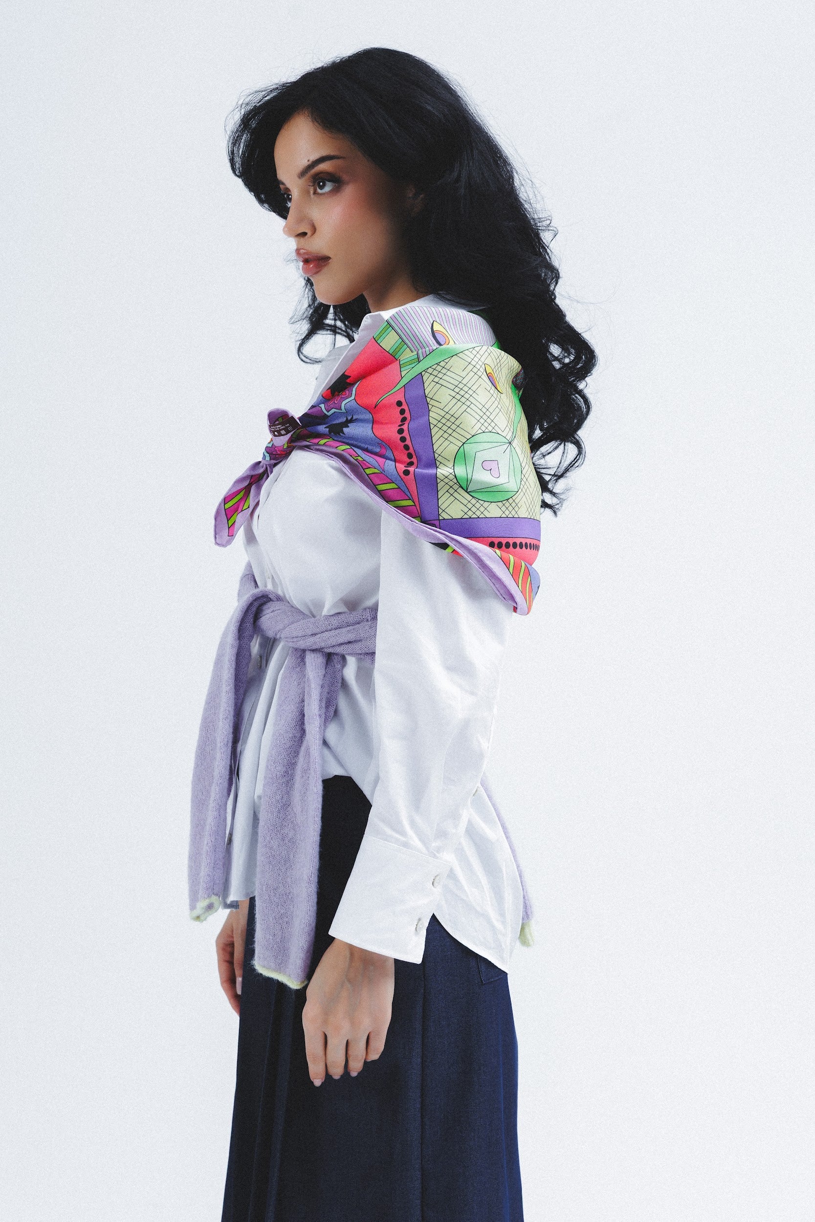 Model wearing colorful silk scarf on her shoulders