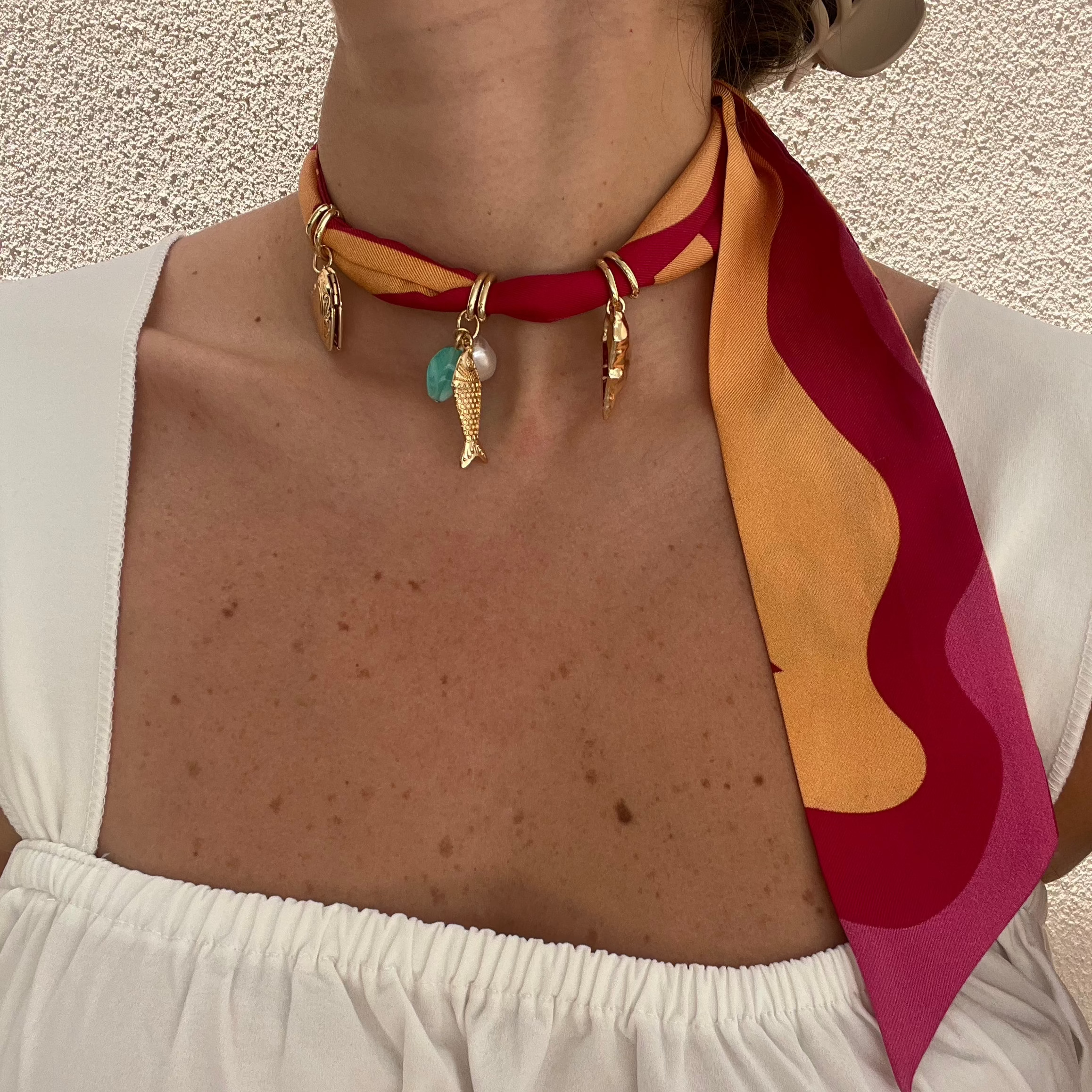 necklace with charms on silk twill scarf