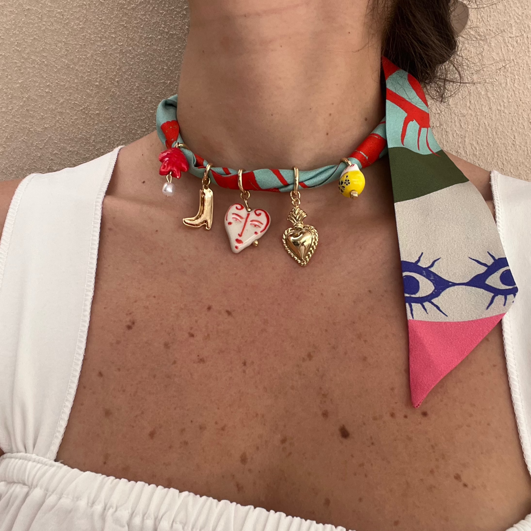 necklace with charms on silk twill scarf