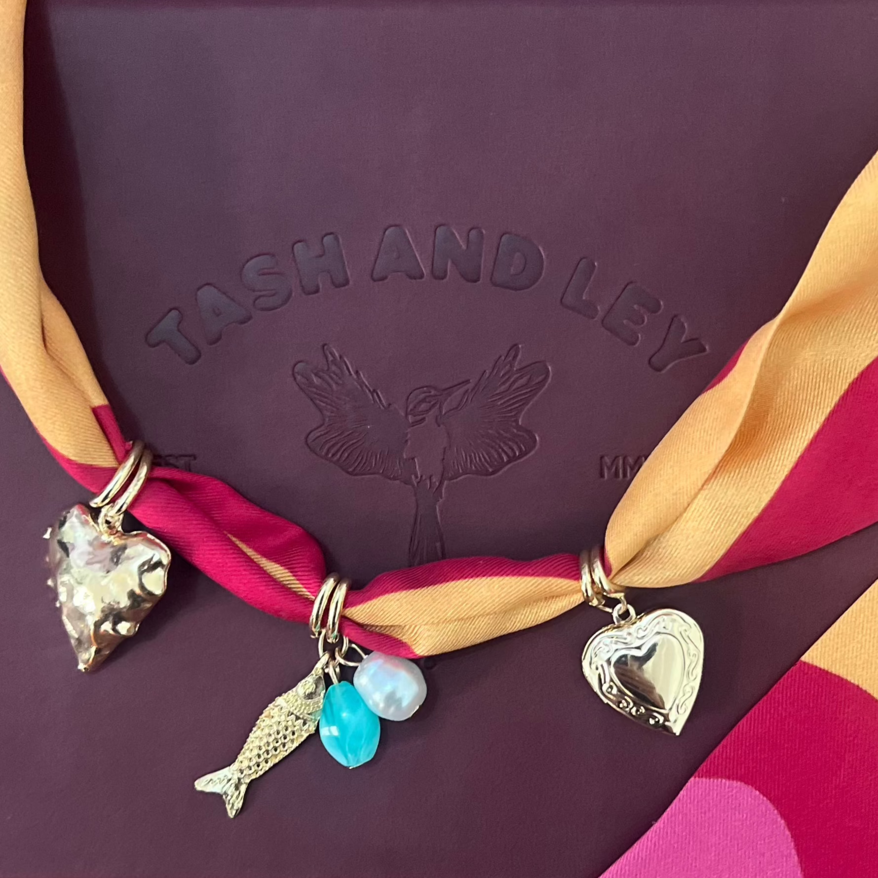 necklace made from silk fabric and charms