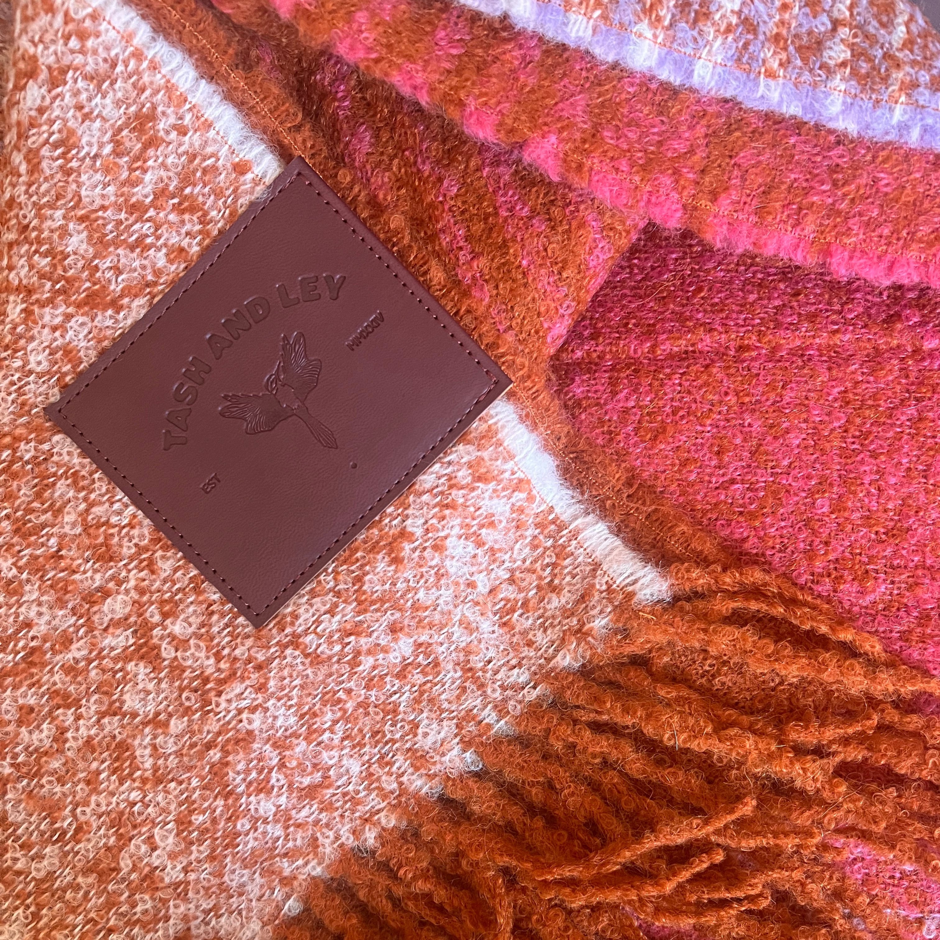 details of alpaca wool winter scarves in orange pink lilac threads