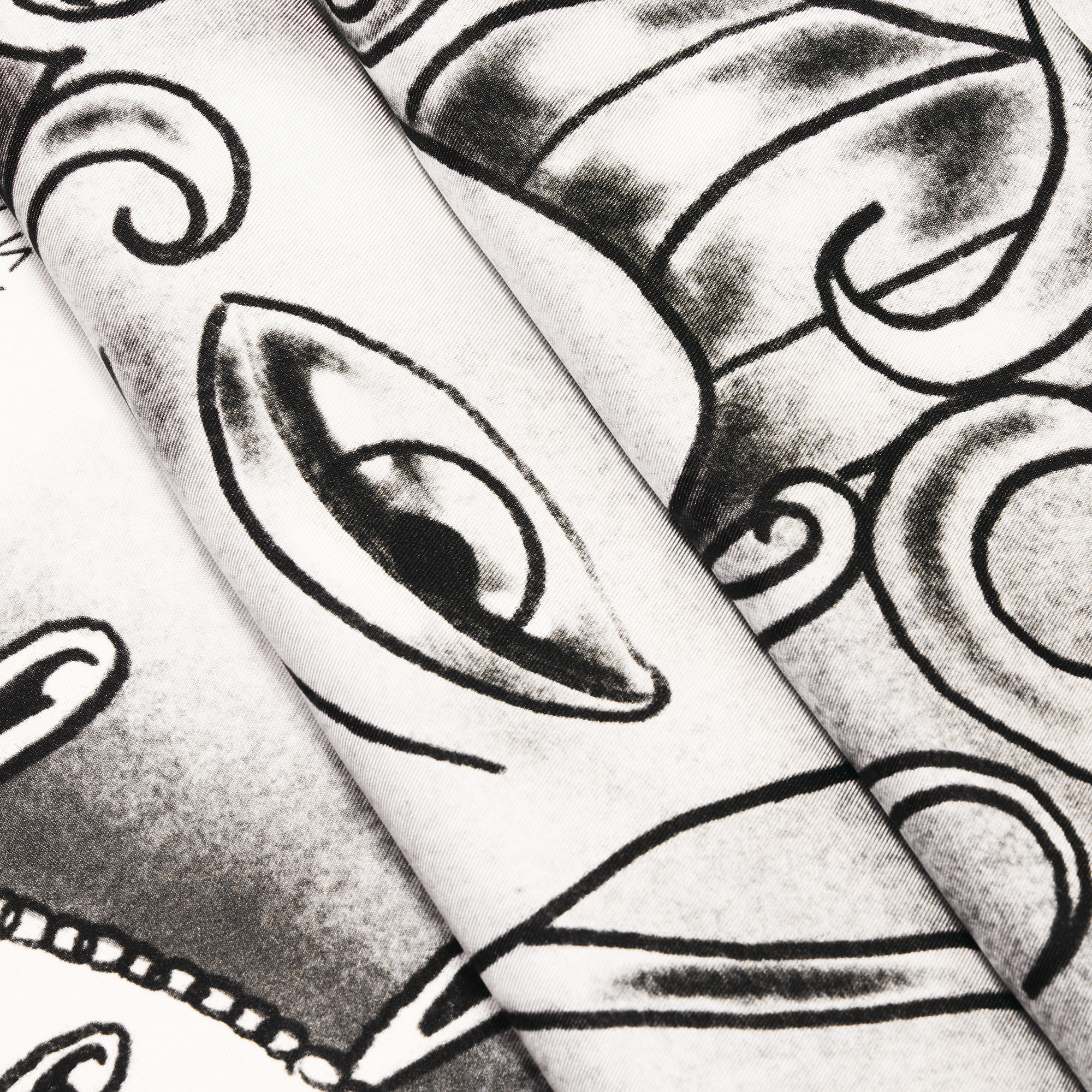 close up of black and white silk twill scarf design with eye drawing