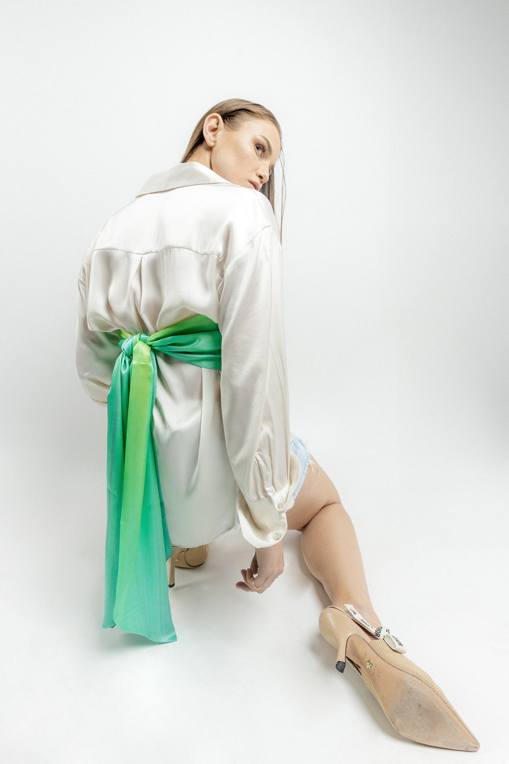 Model wearing green silk twill long rectangle scarf as bandeau top