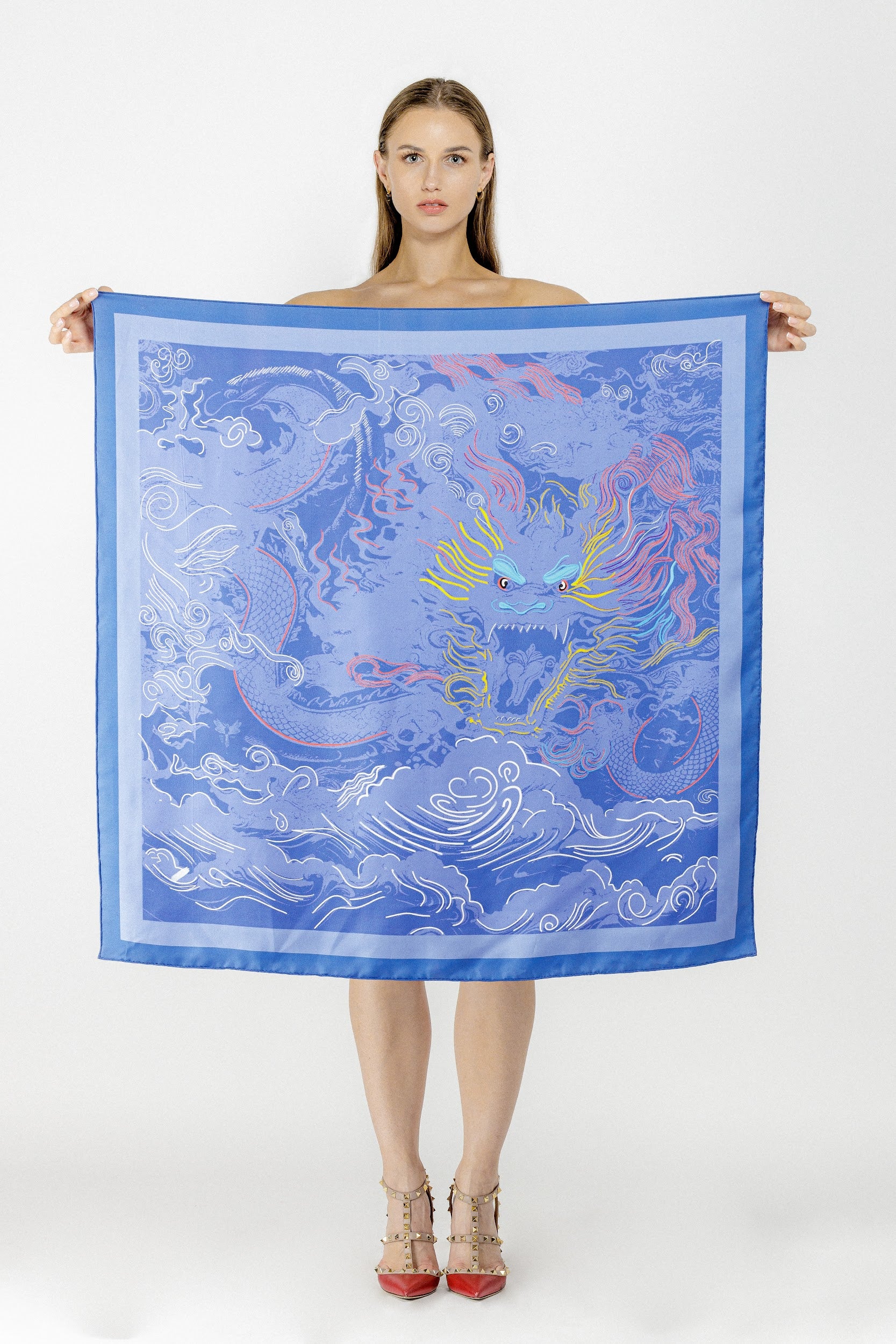 model holding lilac purple silk twill square scarf with dragon design