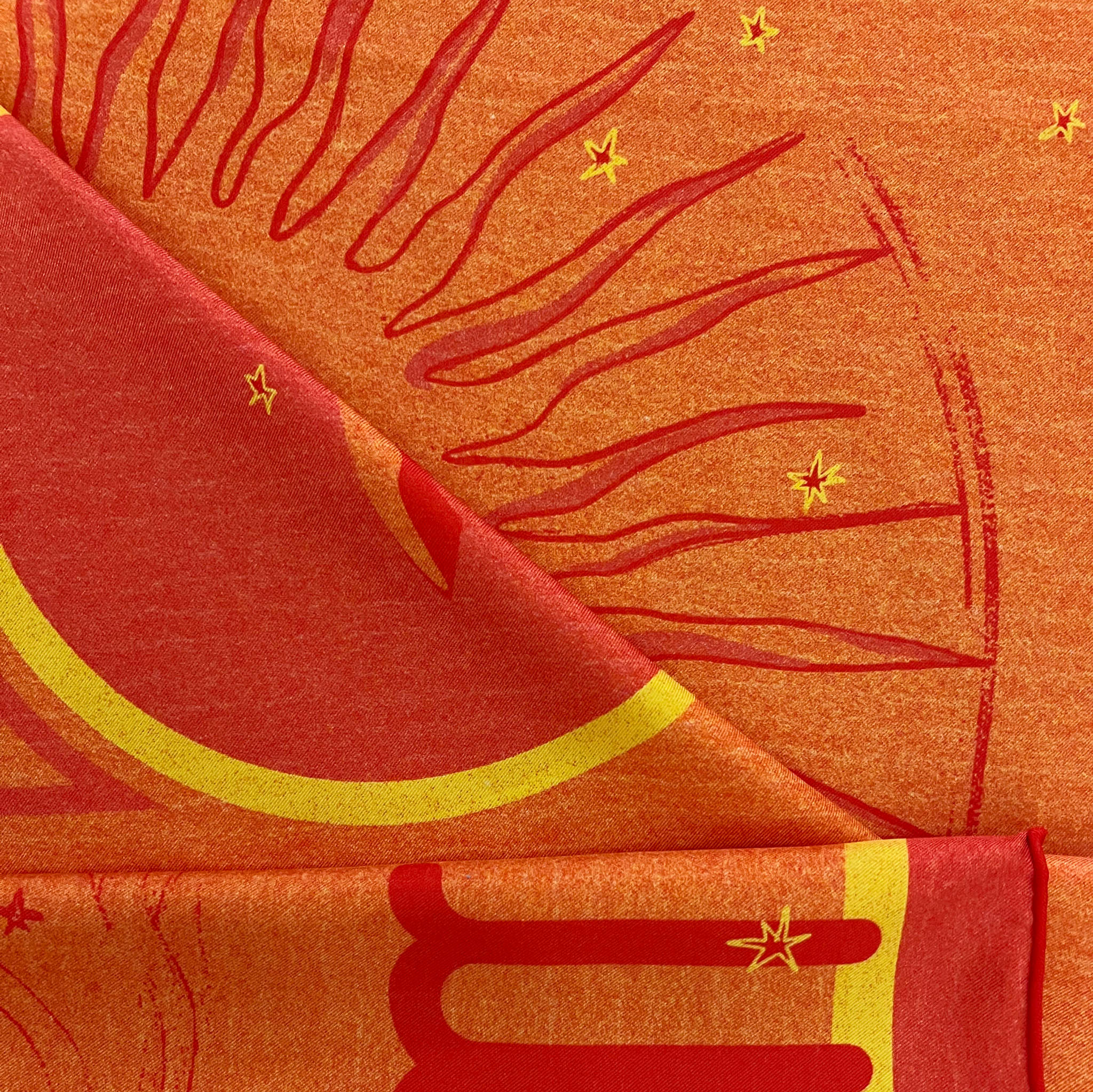 zoom on silk twill fabric with pink and yellow print