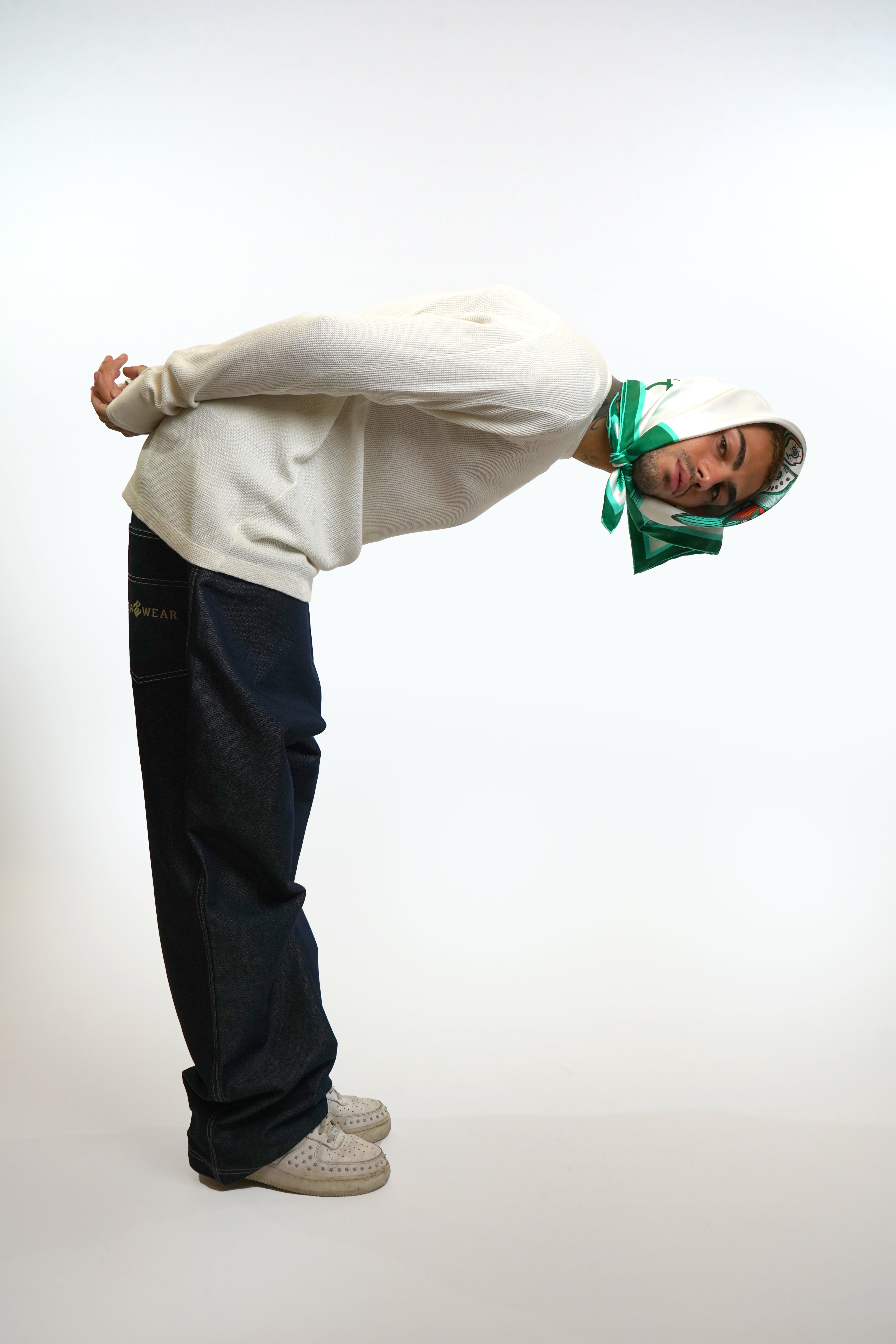Male model wearing silk twill square scarf around head