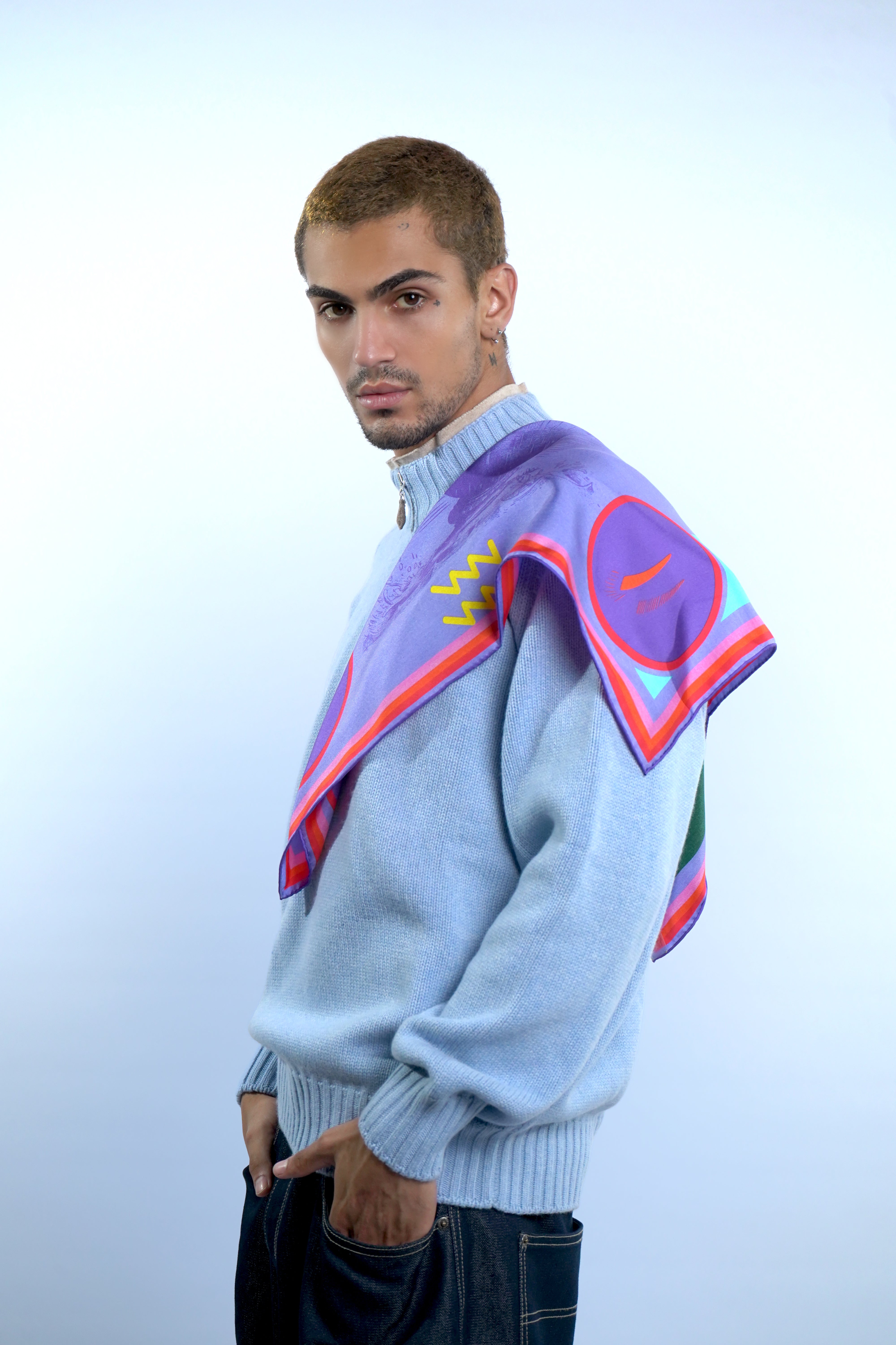 Male model wearing astrology Aquarius design silk square scarf on shoulder