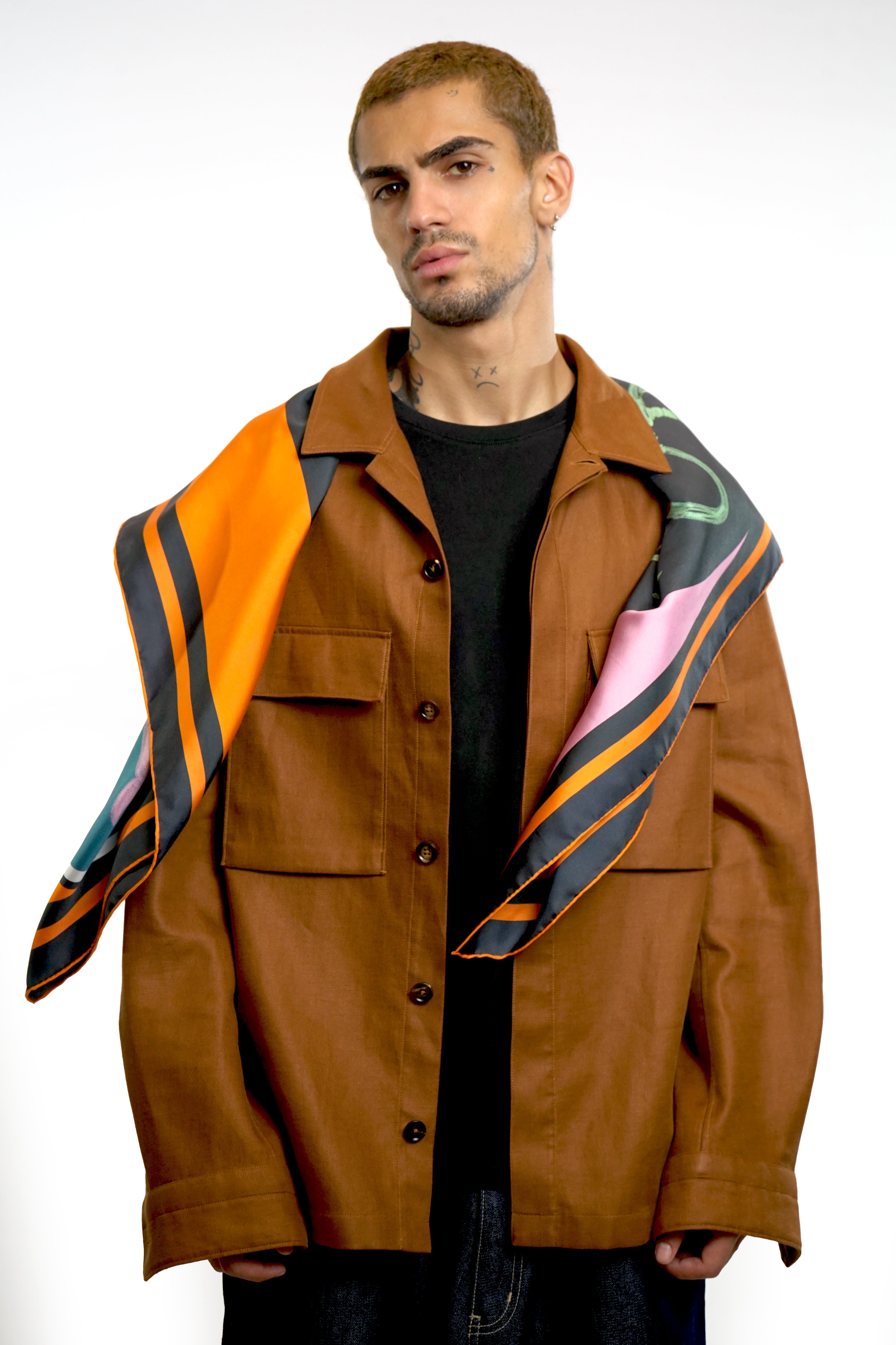 Male model wearing silk twill square scarf over shoulders