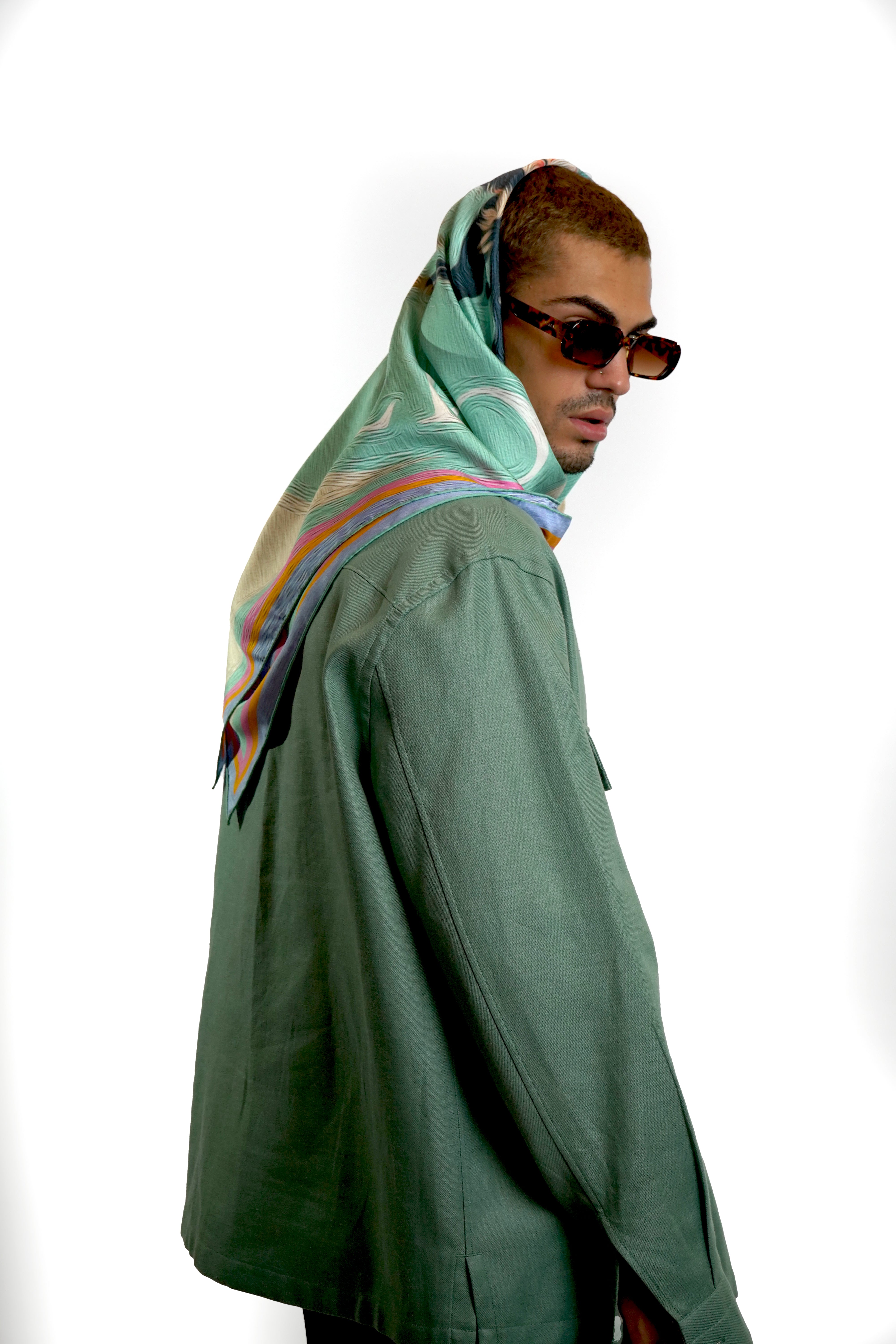 Male model wearing blue silk twill square scarf as head wrap