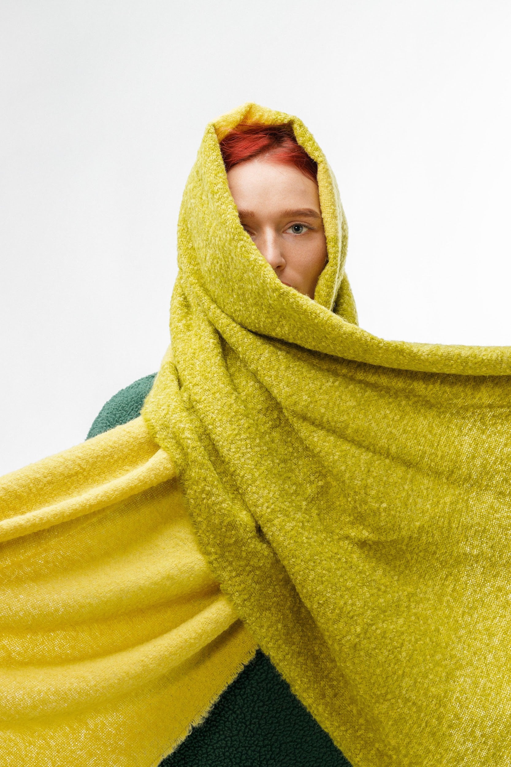 Model wearing alpaca wool scarf in yellow and green color