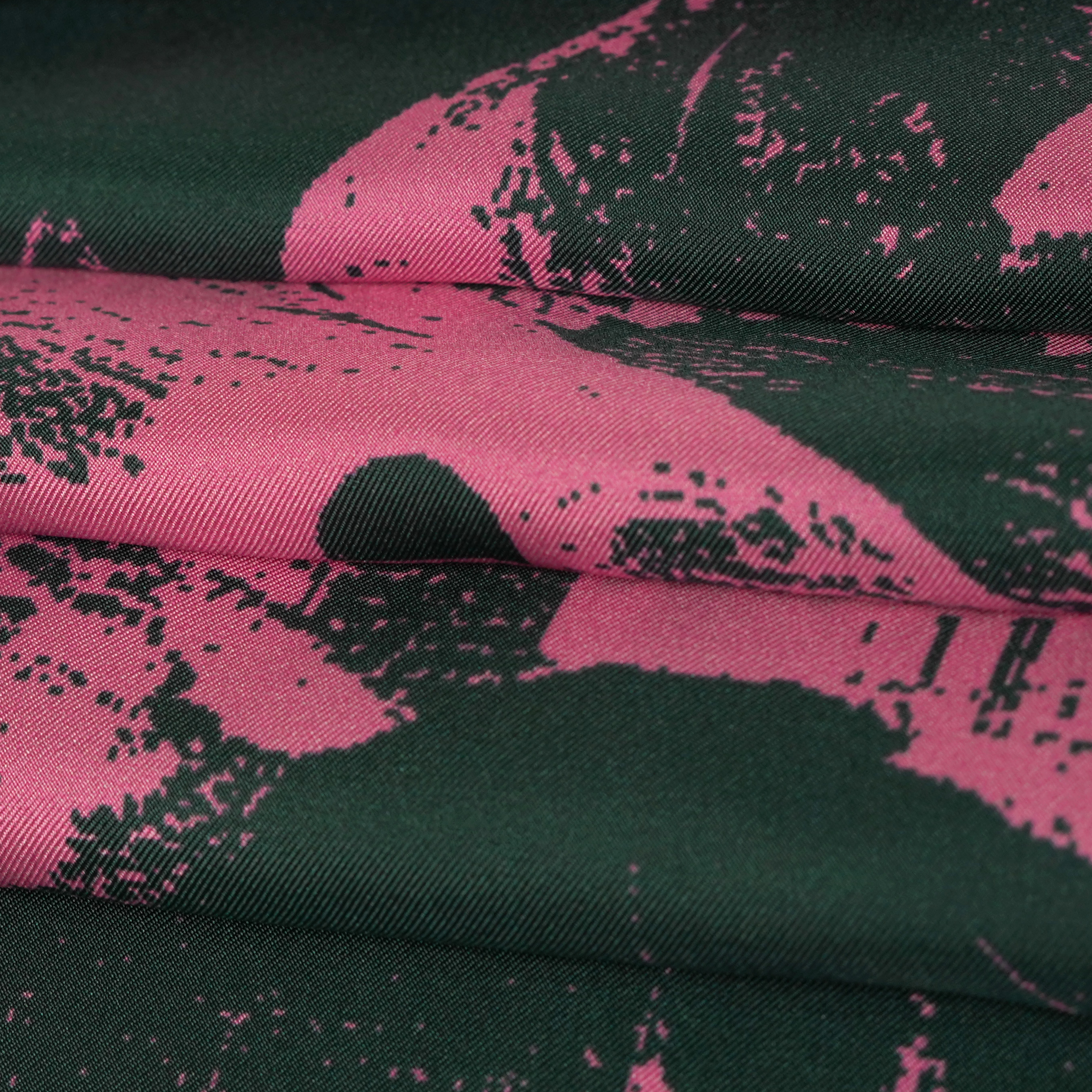 zoom on silk twill fabric with petrol green and pink print colors