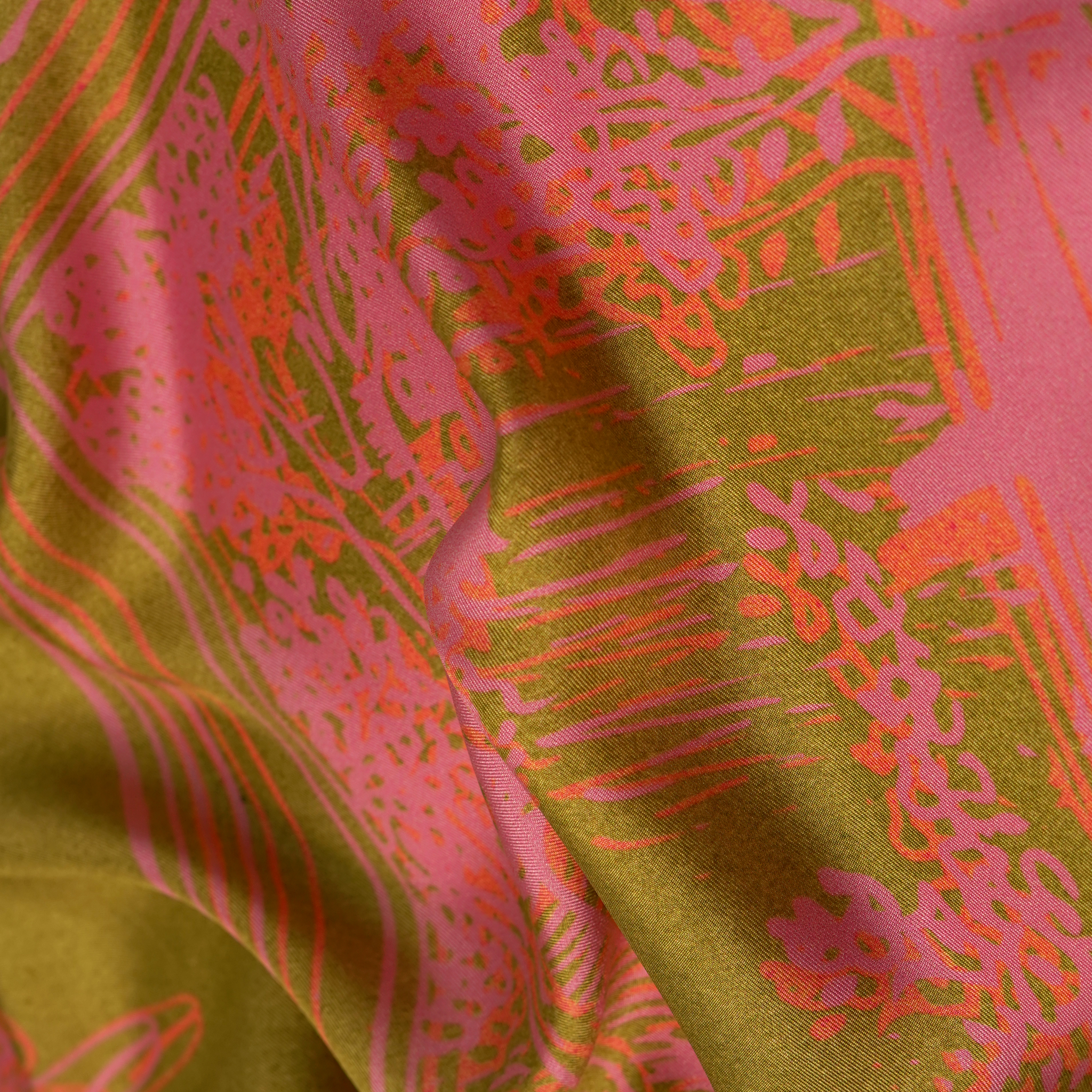 Zoom on silk twill fabric in green and pink