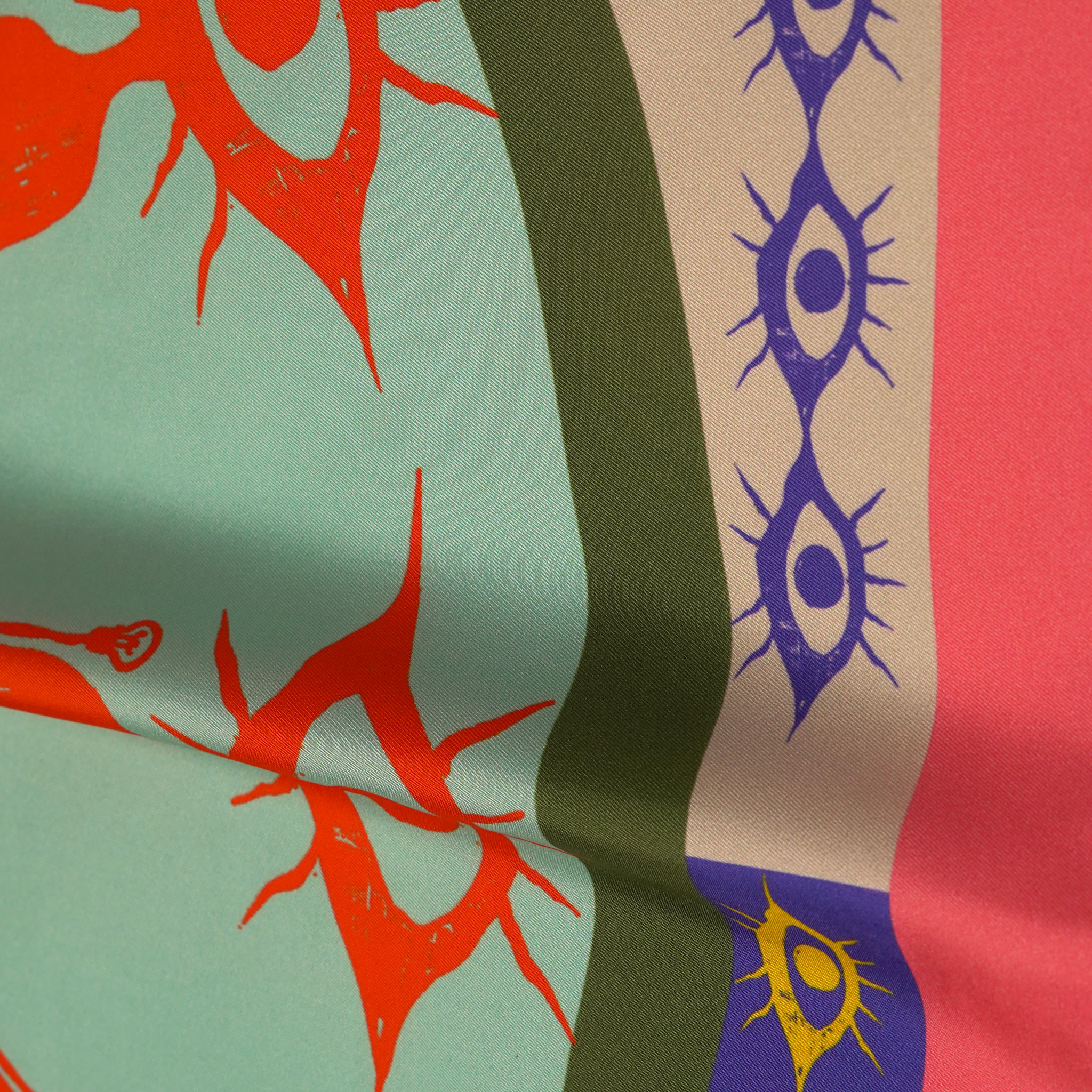 zoom on silk twill fabric with orange blue green pink yellow white print