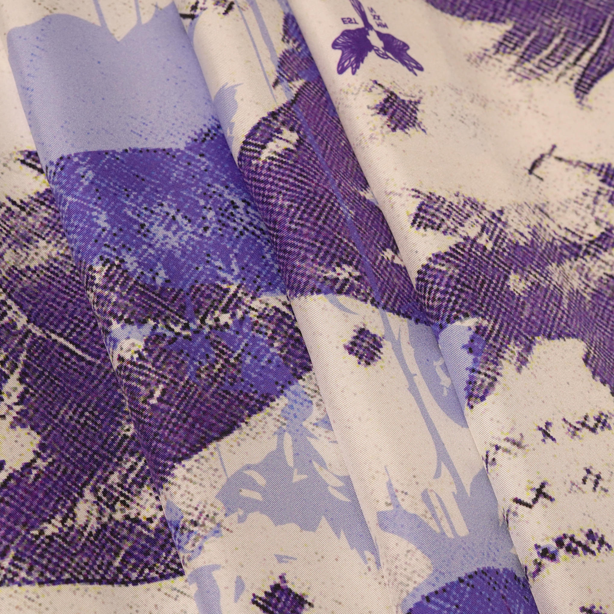 Close-up of silk twill fabric with blue and white design
