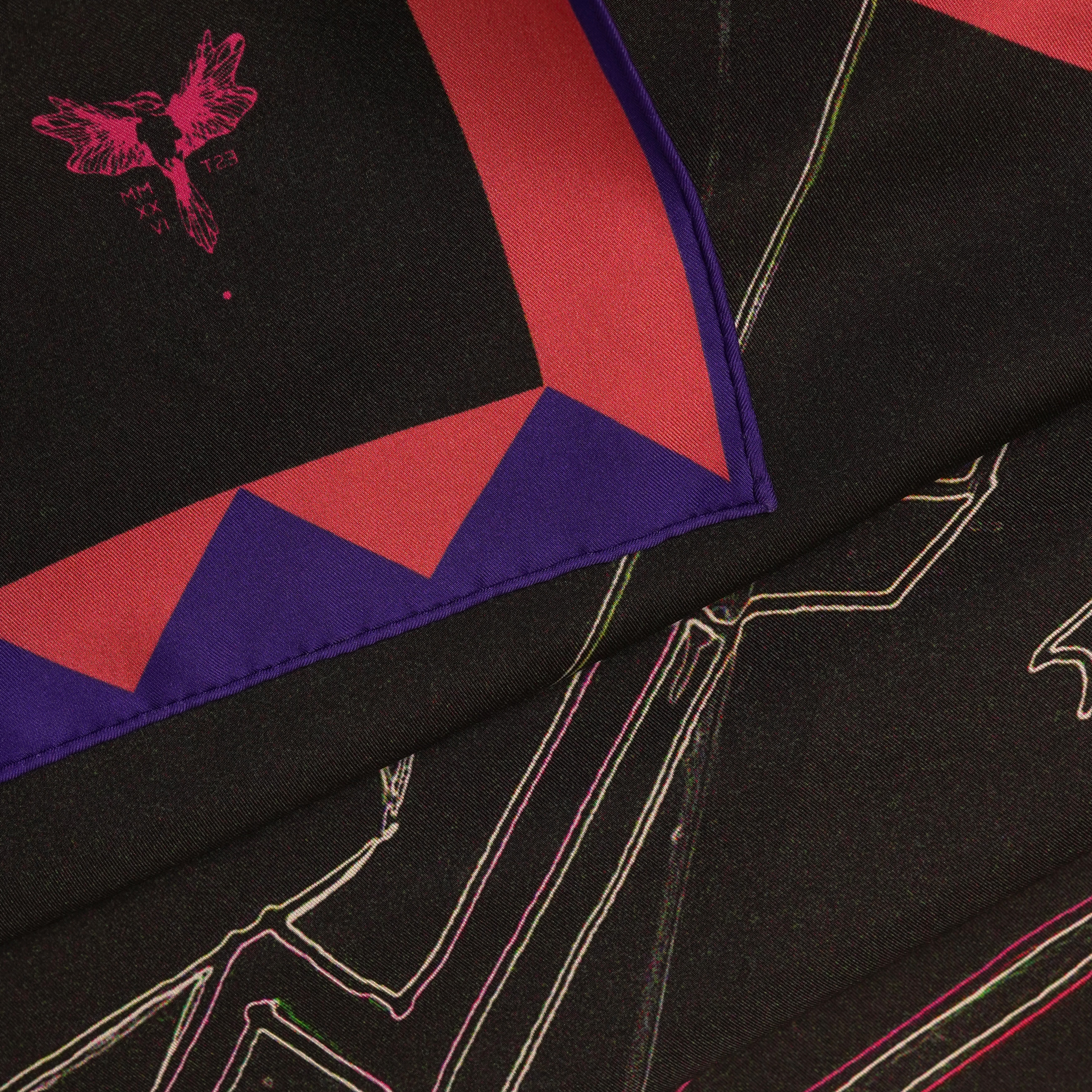 zoom on silk twill fabric with black pink and blue print