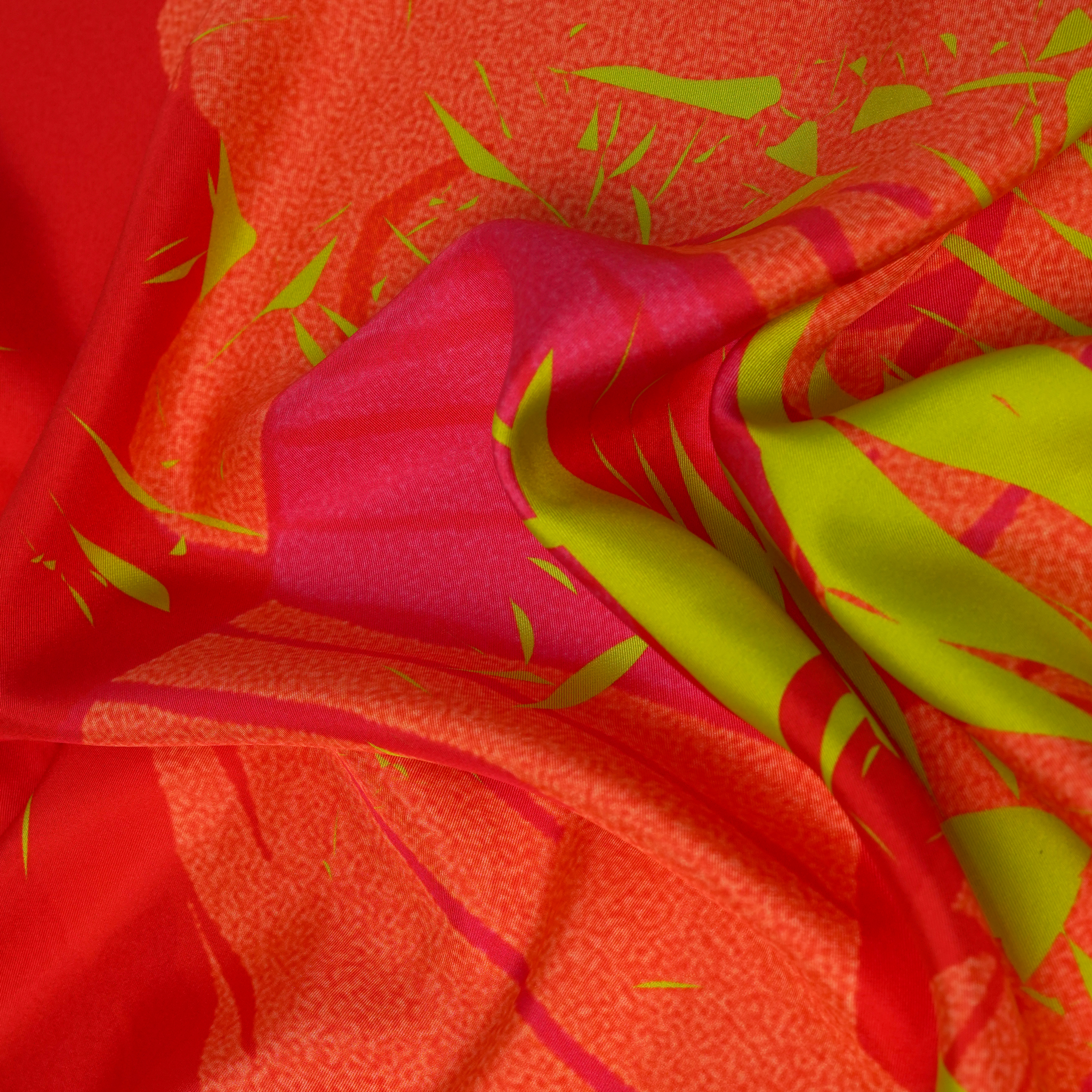 zoom on silk twill fabric in red pink yellow color print