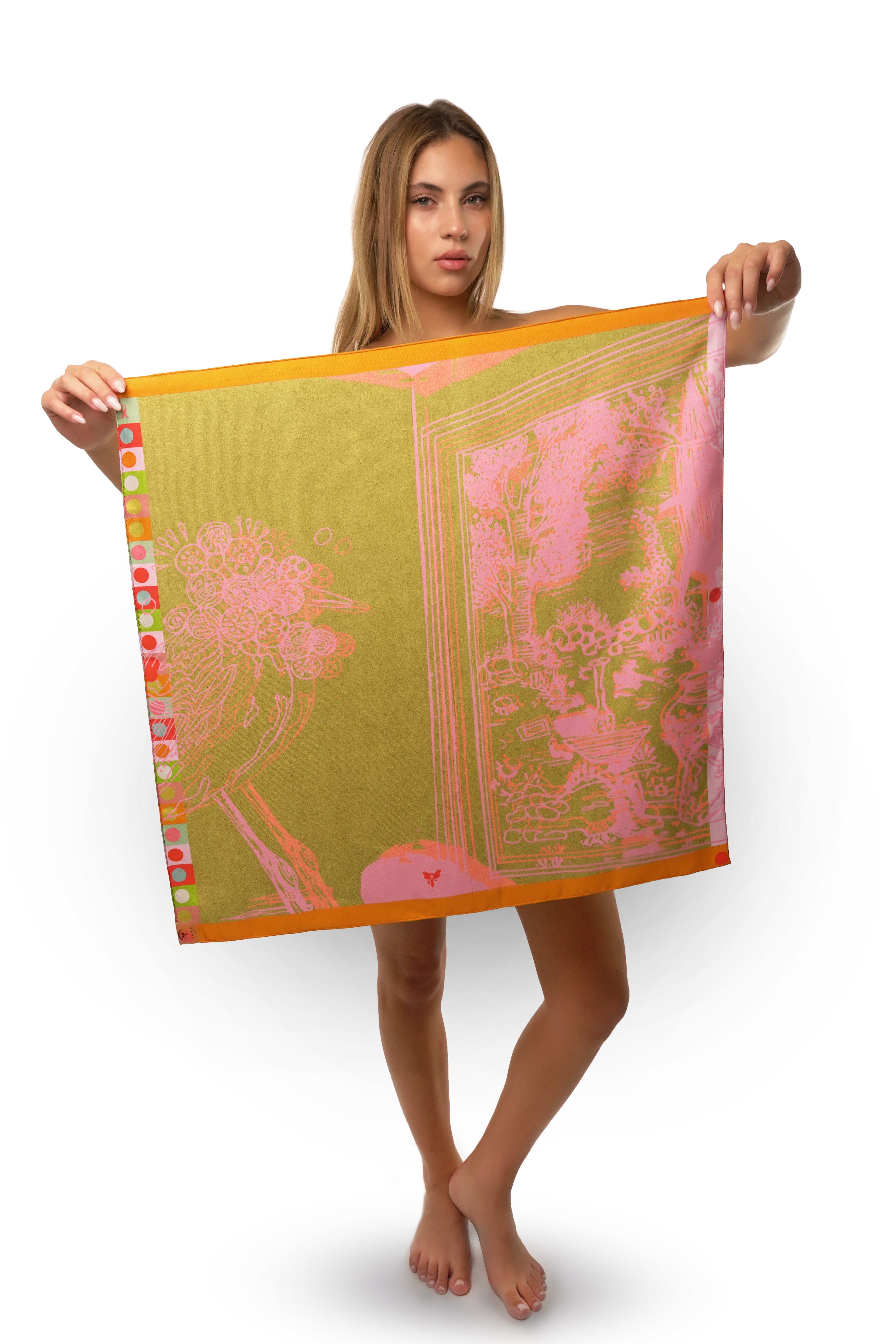 Model holding a silk twill square scarf with bird print