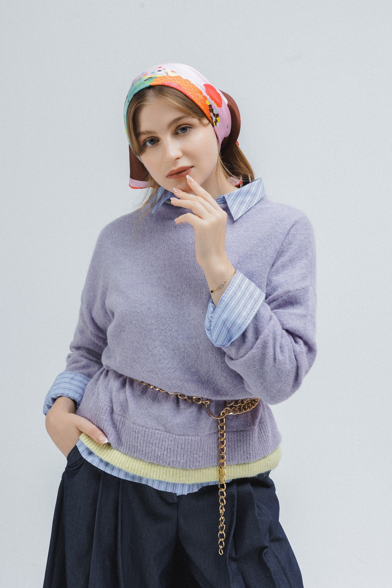 Model wearing a colorful silk scarf as a bandana on her hair