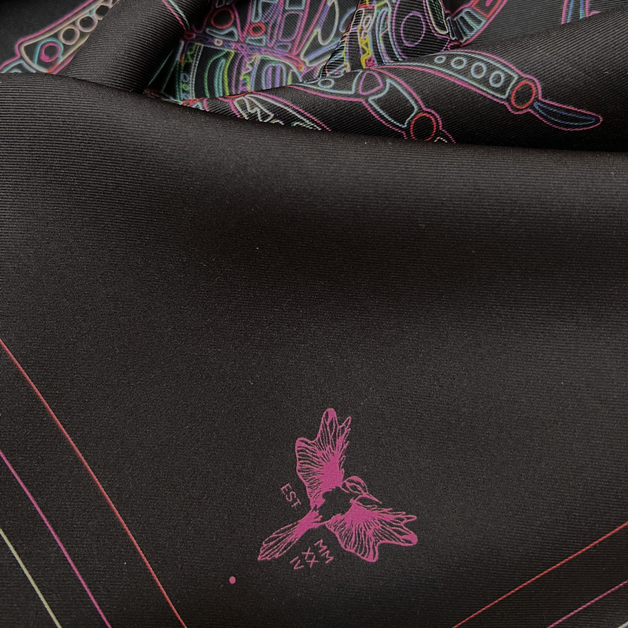 zoom on silk twill fabric with Scorpio design black print