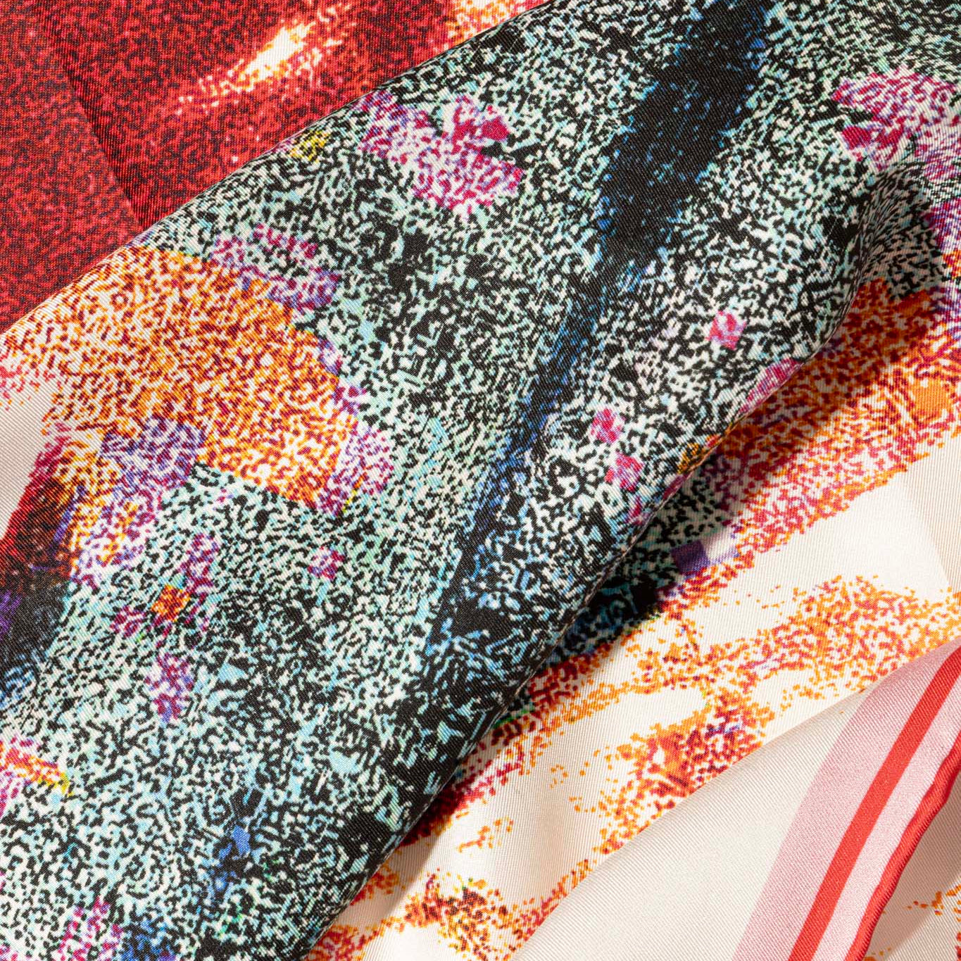 Close-up of a textured silk fabric with colorful patterns