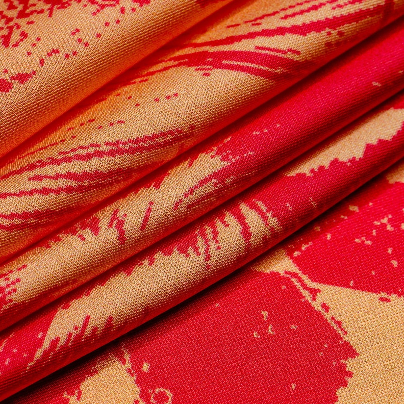 Zoom on silk twill scarf fabric in pink and orange colors