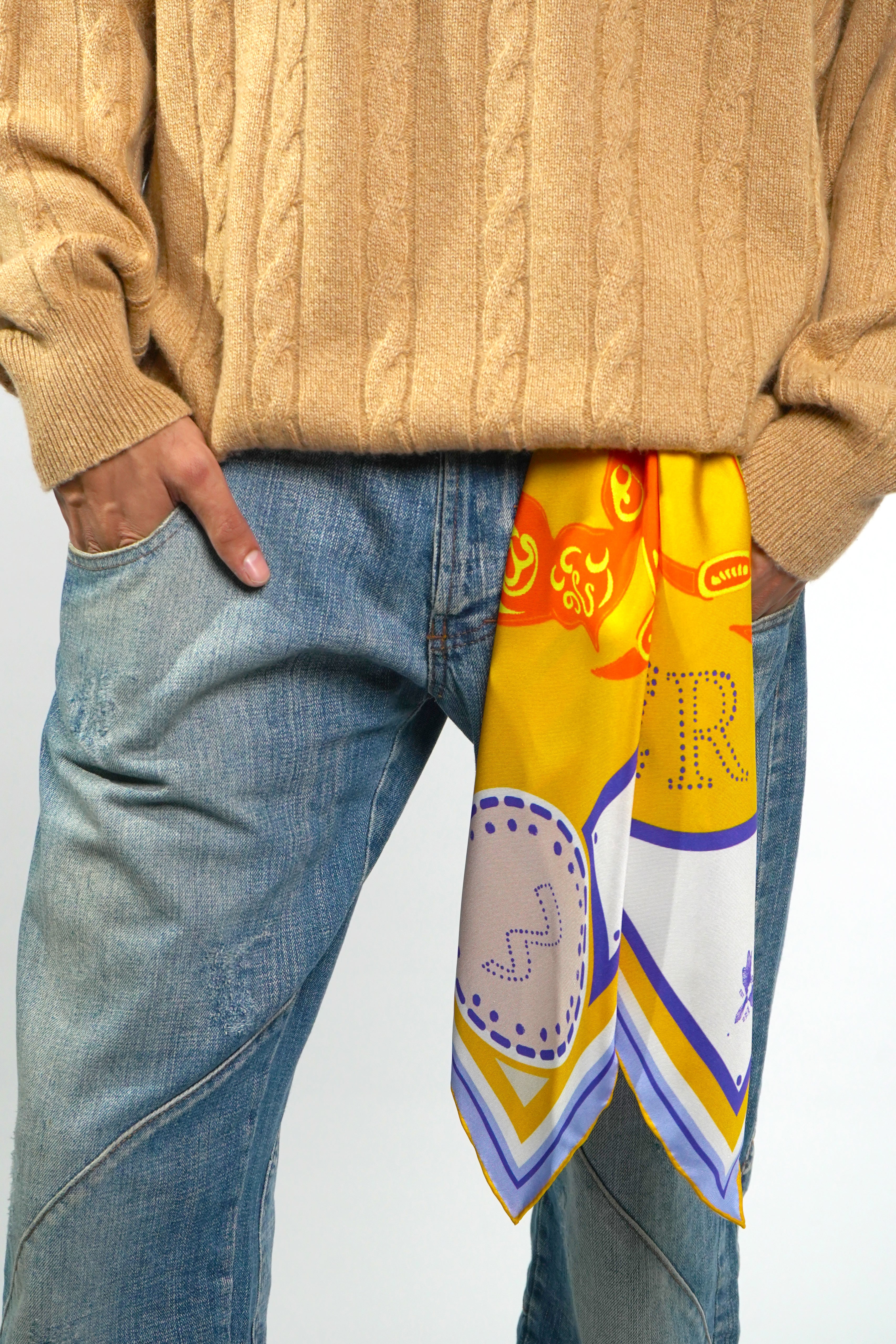 Male model wearing silk twill square scarf with Cancer design as belt