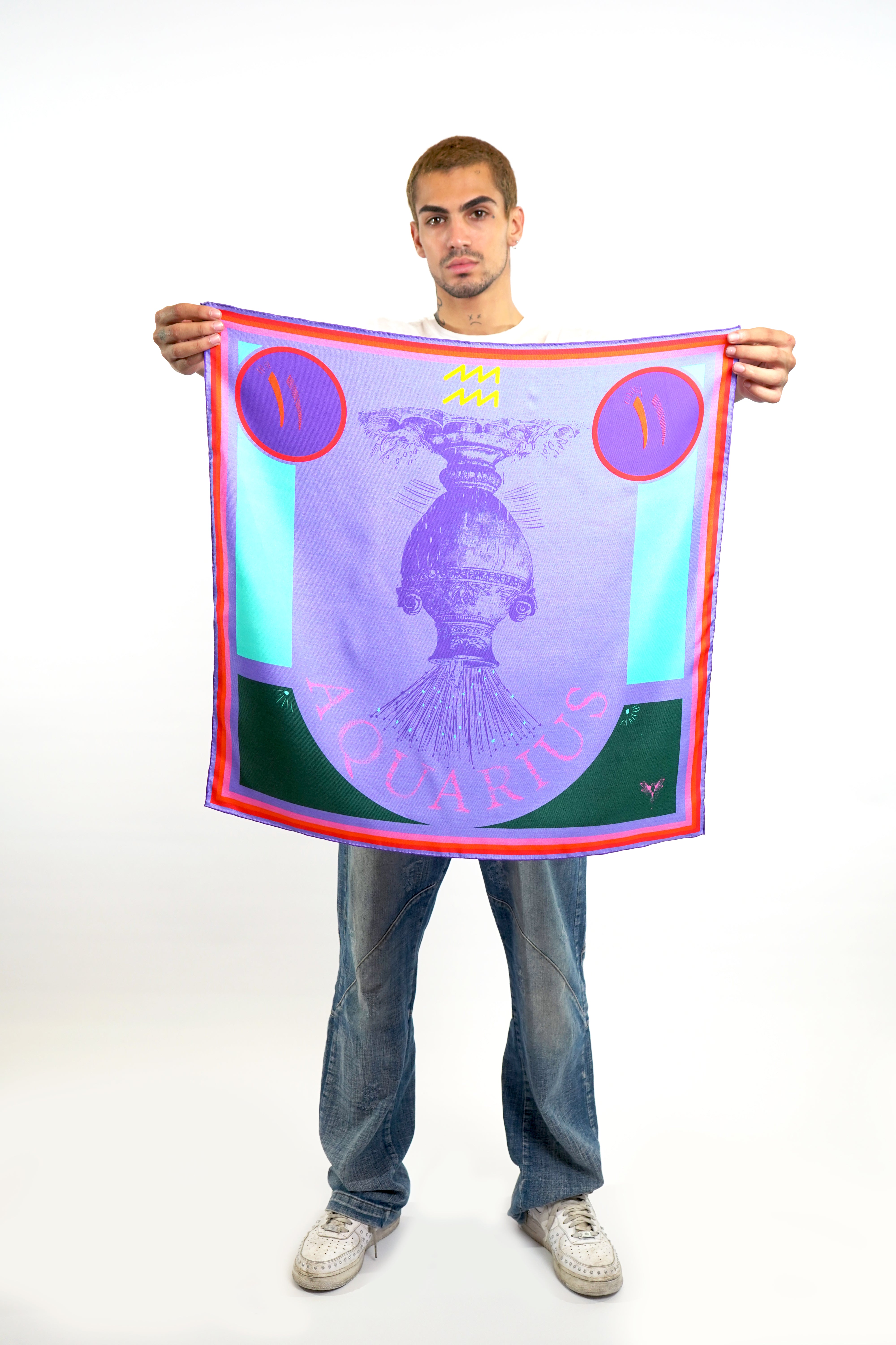 Male model holding astrology Aquarius design silk square scarf