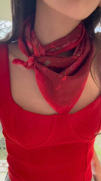 Tutorial video how to style a square silk twill scarf around the neck, cowboy look