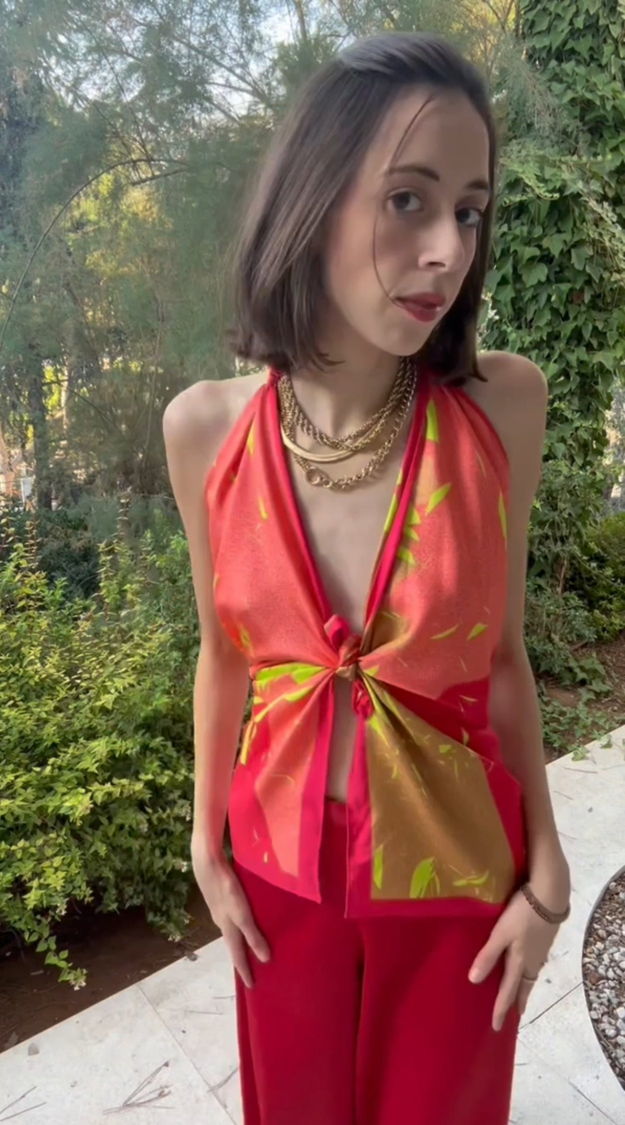 Tutorial video how to style a silk twill square scarf as a top with a chain bracelet